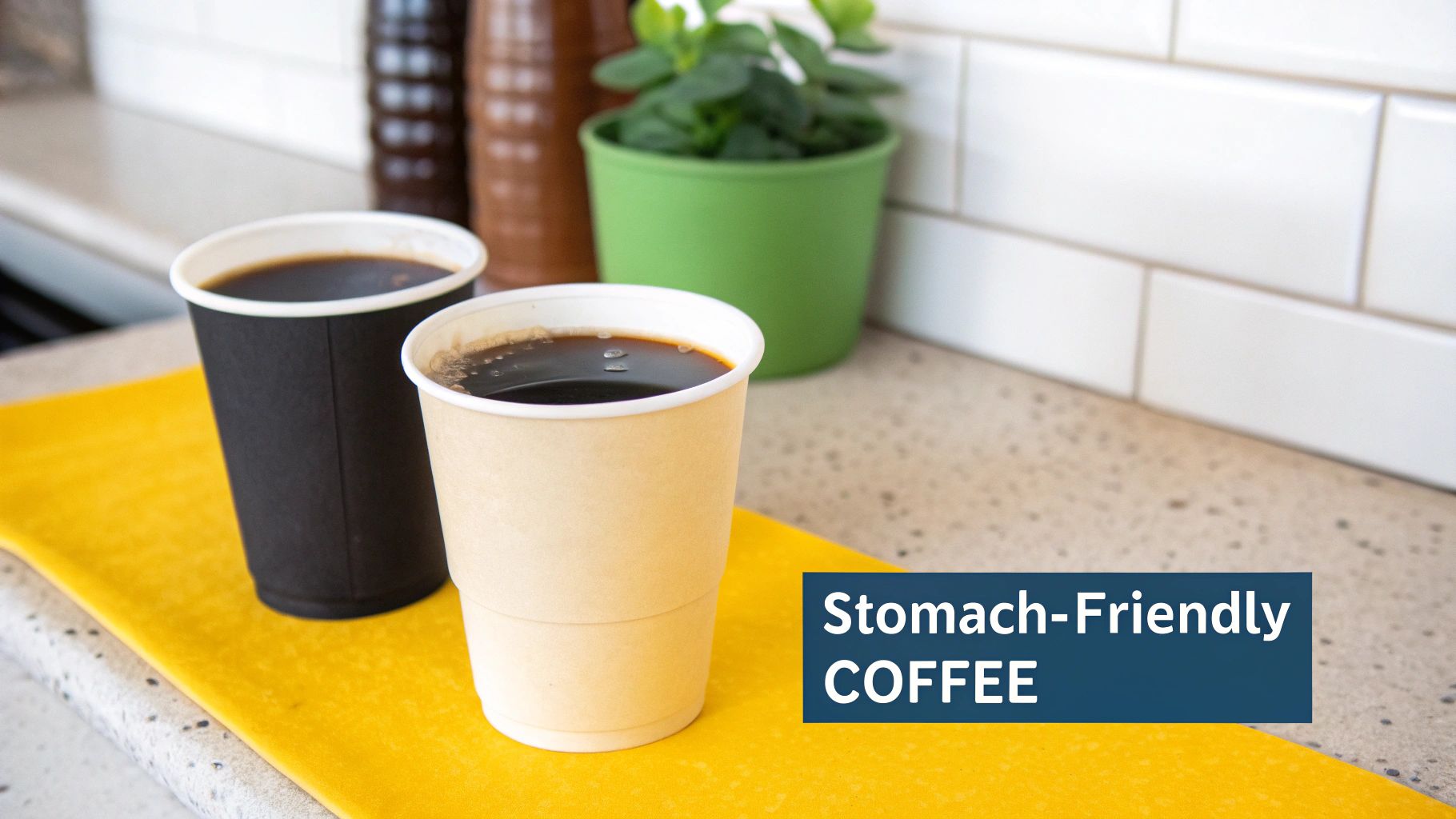 Two cups of black coffee, one black and one beige, on a yellow mat on a kitchen counter.