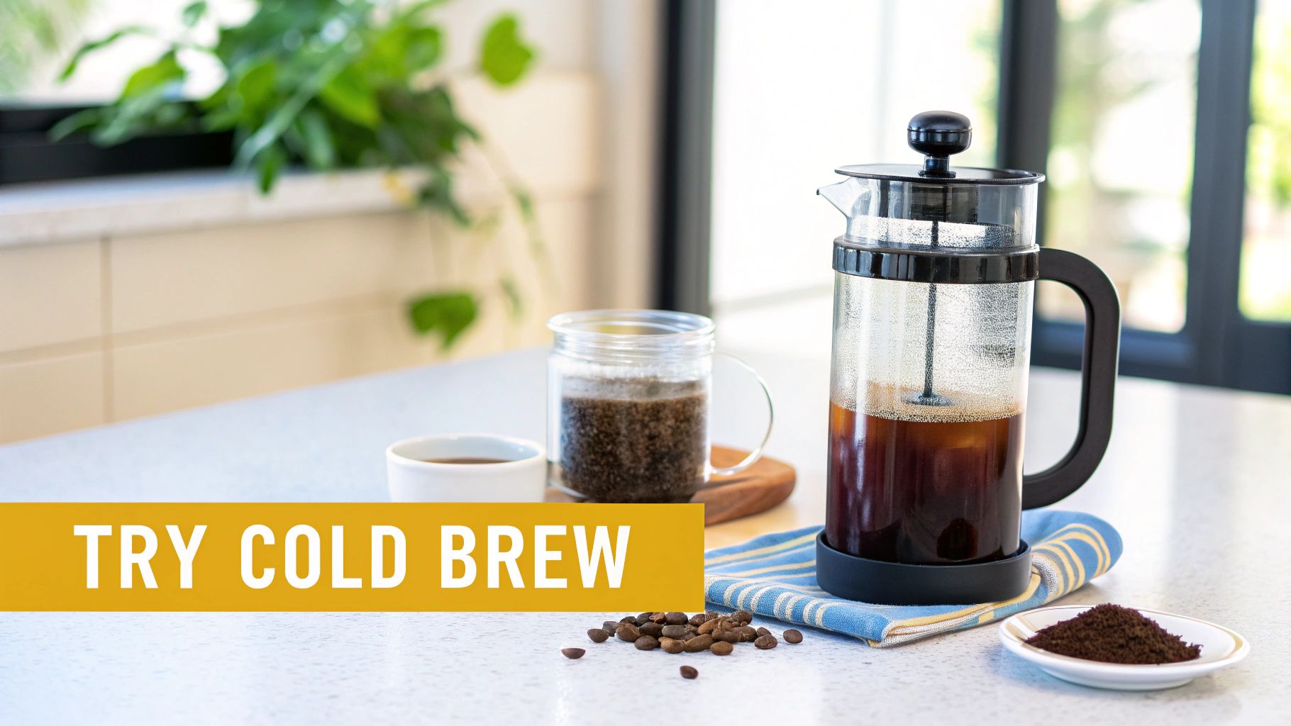 A kitchen counter displays a French press with cold brew, coffee grounds, and beans, inviting users to try cold brew.