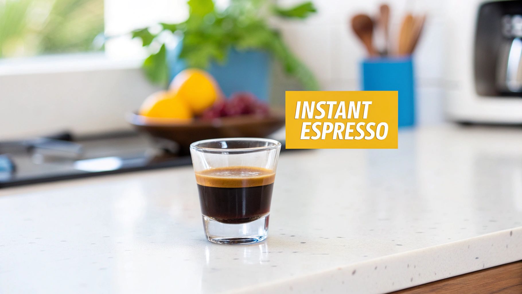 Fresh espresso shot with golden crema in clear glass on modern kitchen counter