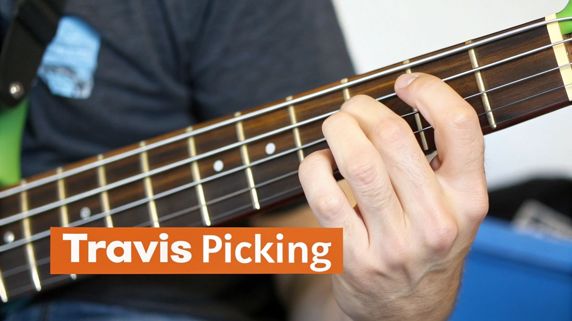 Musician's hand fretting notes on a bass guitar fretboard for Travis Picking.