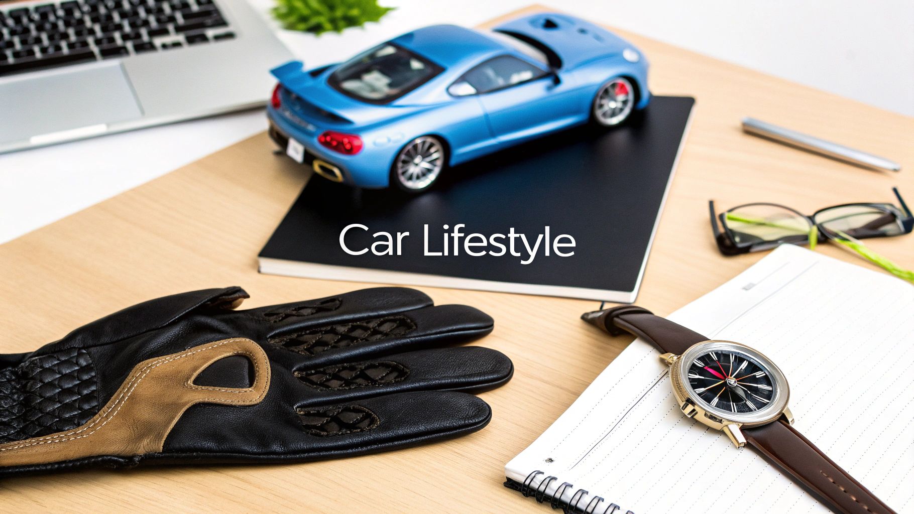 A flat lay displaying car lifestyle essentials, including a blue sports car model, driving gloves, and a wristwatch.