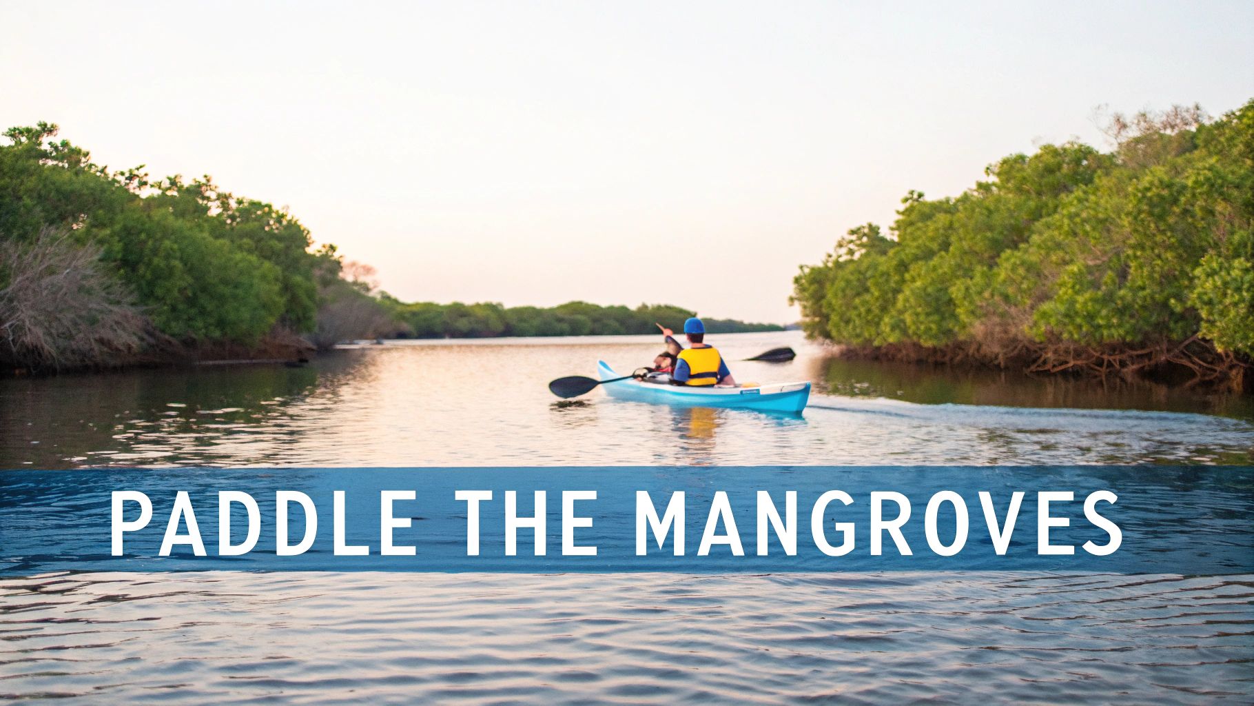 Two people kayaking through scenic mangrove tunnels in Marathon Florida at sunset