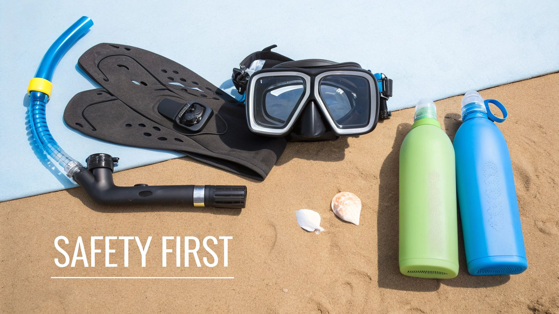 A collection of snorkeling gear laid out on a wooden dock
