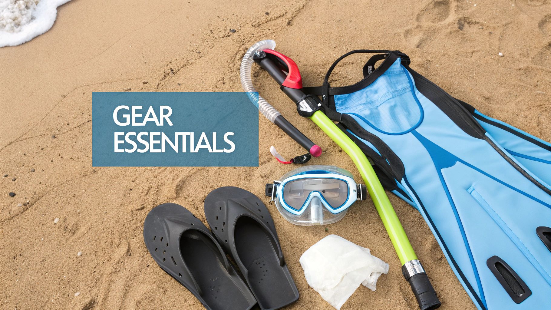A collection of snorkeling gear, including a mask, snorkel, fins, and a camera, laid out on a wooden dock.