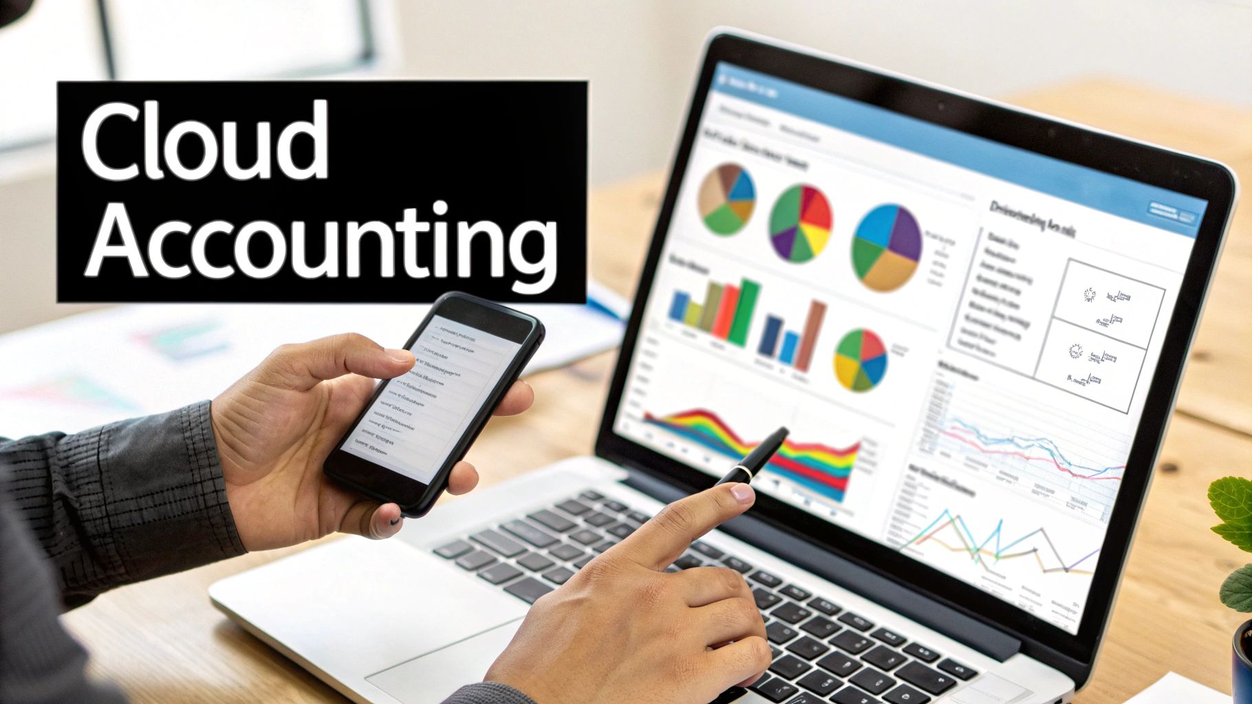 Professional using a laptop with financial charts and a smartphone for cloud accounting.