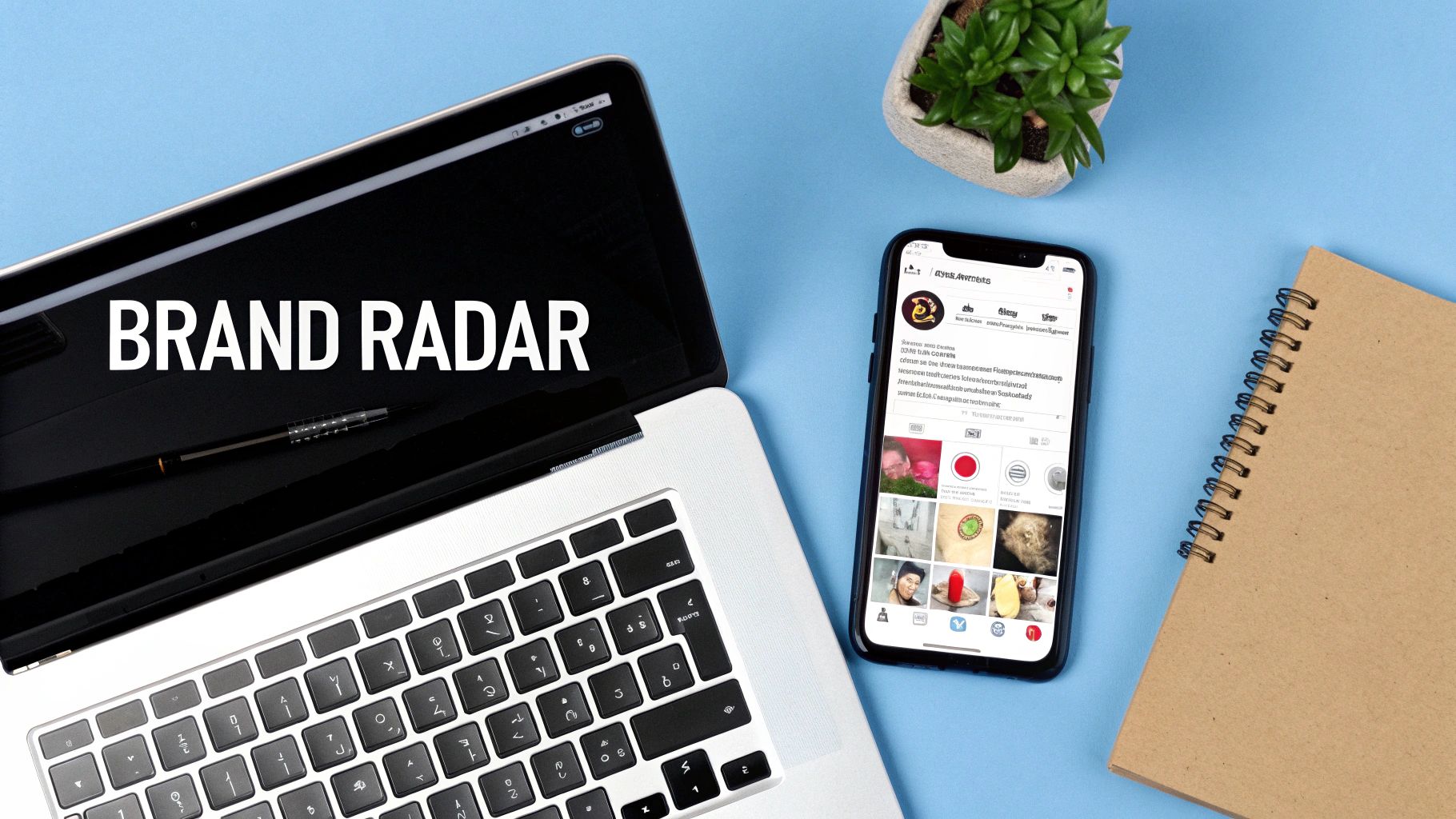 Brand radar text on laptop screen with smartphone displaying social media profile and notebook on blue desk