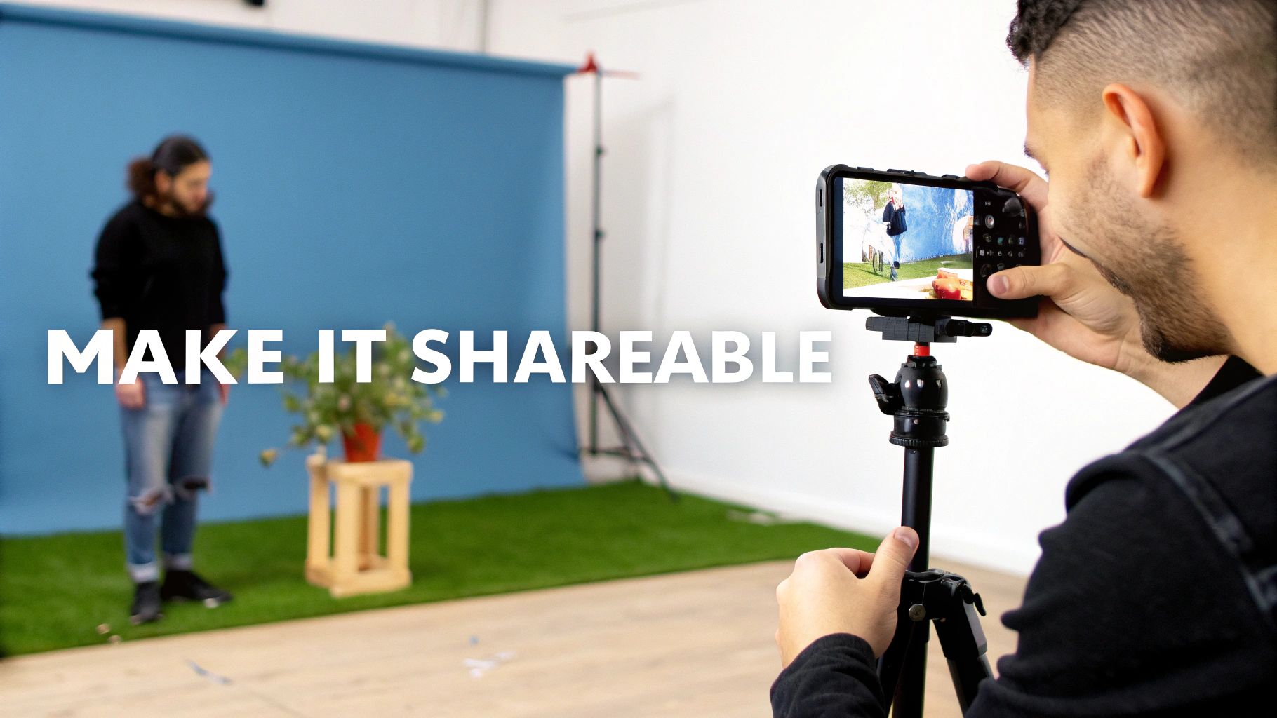 A photographer uses a smartphone on a tripod to capture an image of a person in a studio setup.