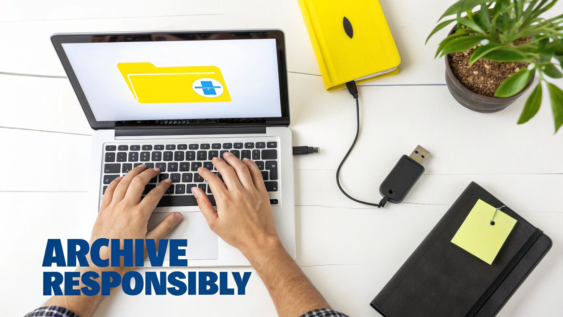Top-down view of hands typing on a laptop, showing a folder icon and external storage devices, with text 'ARCHIVE RESPONSIBLY'.