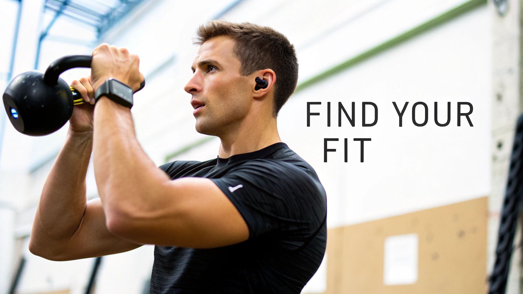 A fit man wearing black earbuds and a smartwatch lifts a kettlebell during a gym workout.