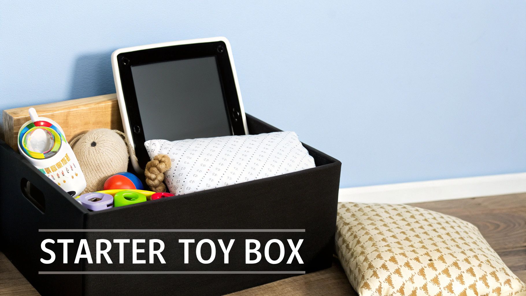 A baby's hand reaching for a colorful, textured sensory toy.