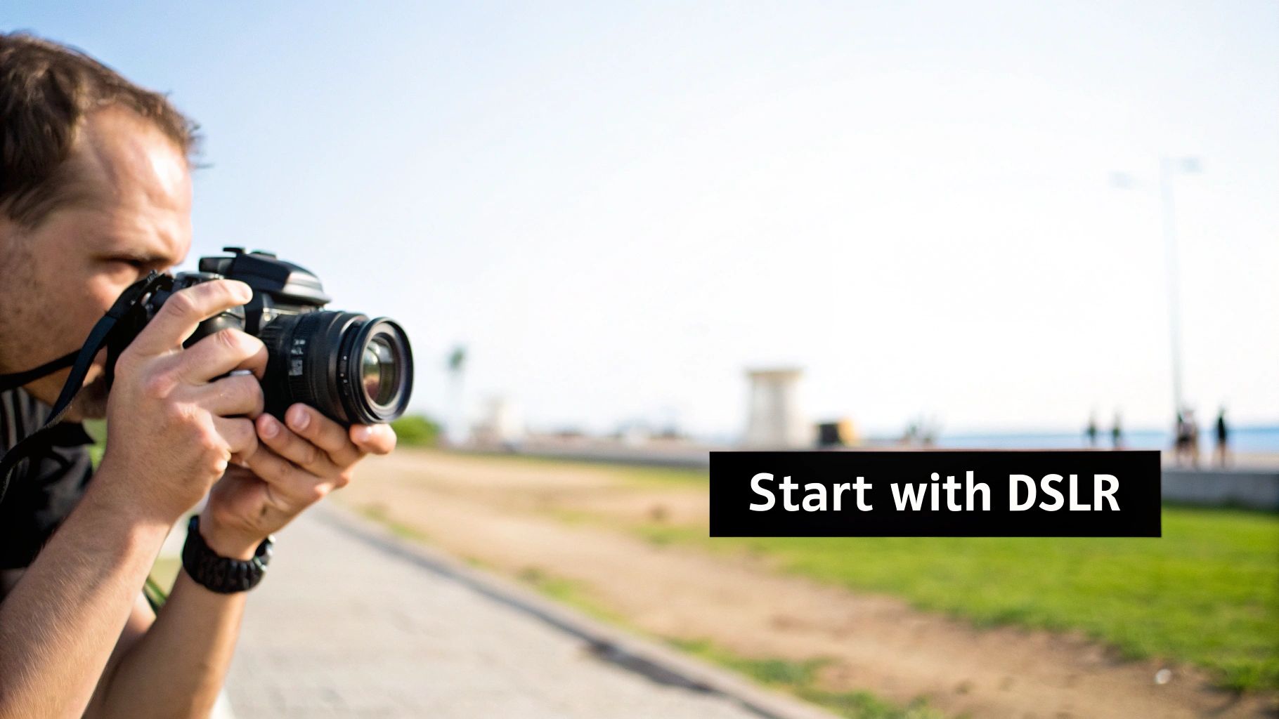 A man holds a black DSLR camera, looking through the viewfinder to take a photo outdoors. Text says 'Start with DSLR'.