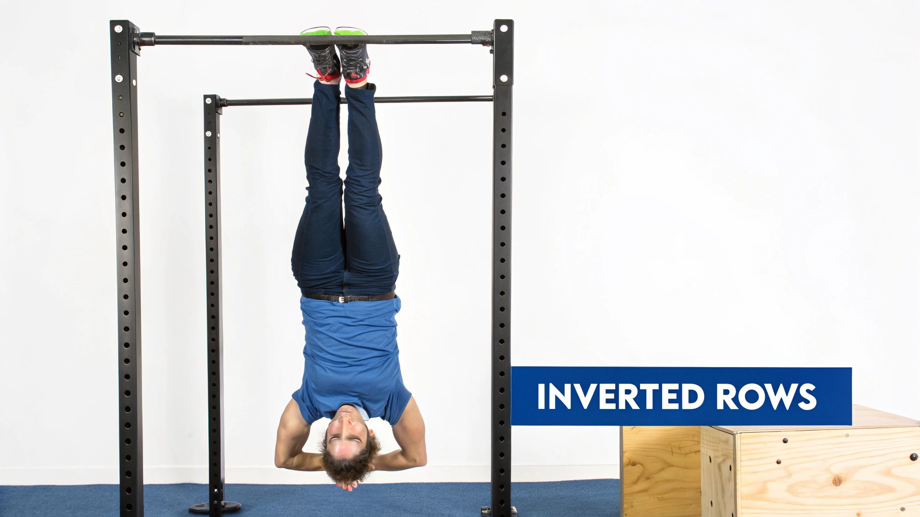 Athlete performing inverted row under a low bar with straight body alignment — strong scapular squeeze at top