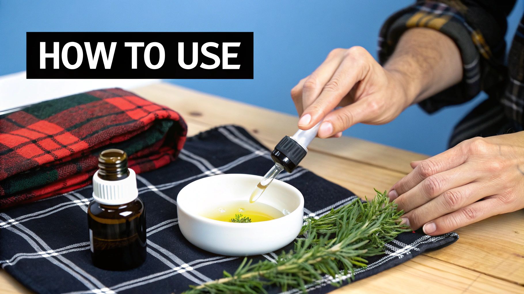 Person dropping essential oil from a dropper into a bowl with herbs and rosemary, showing 'How to Use'.