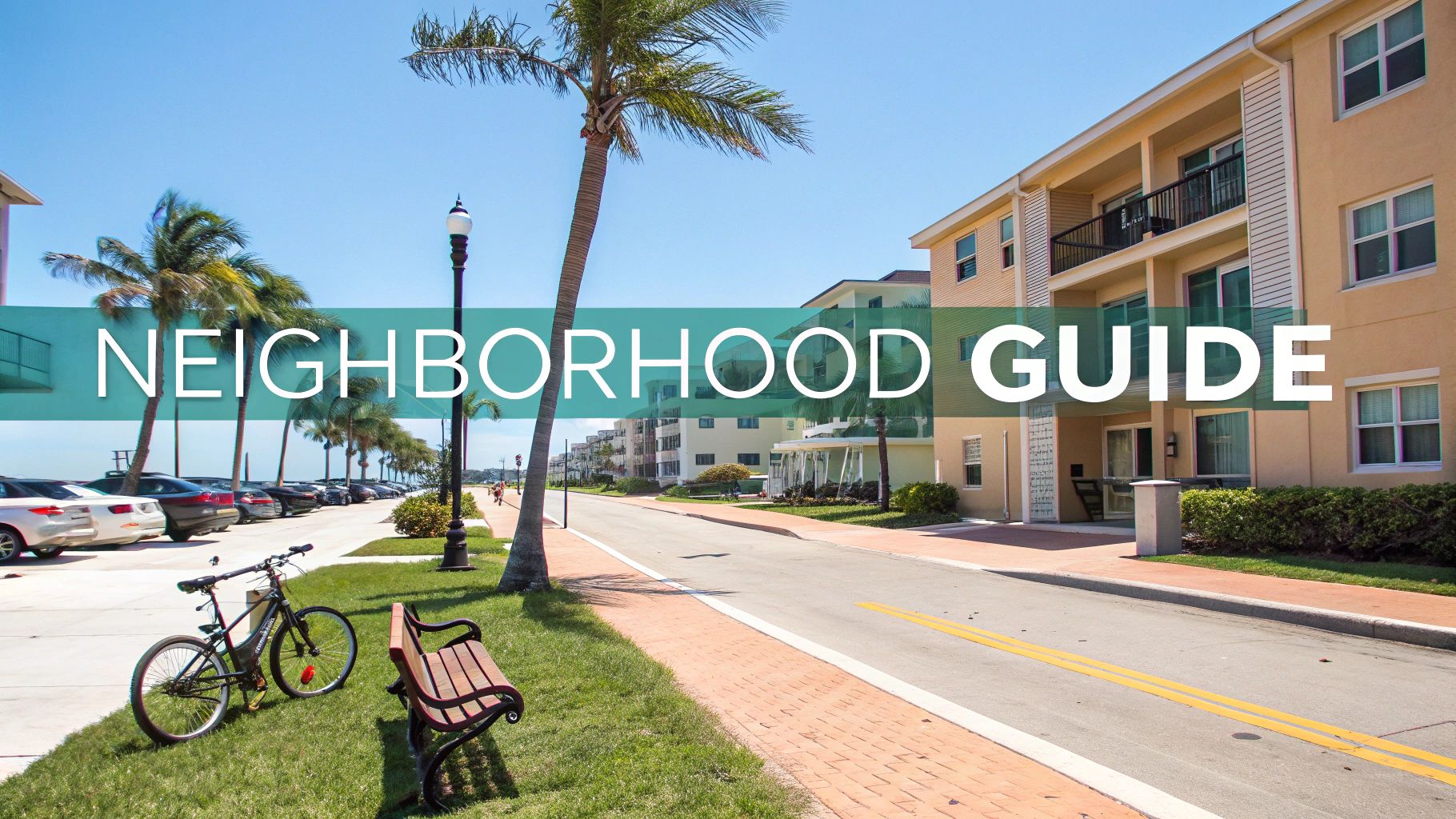 A scenic view of a waterfront neighborhood in Boynton Beach with palm trees and modern buildings.