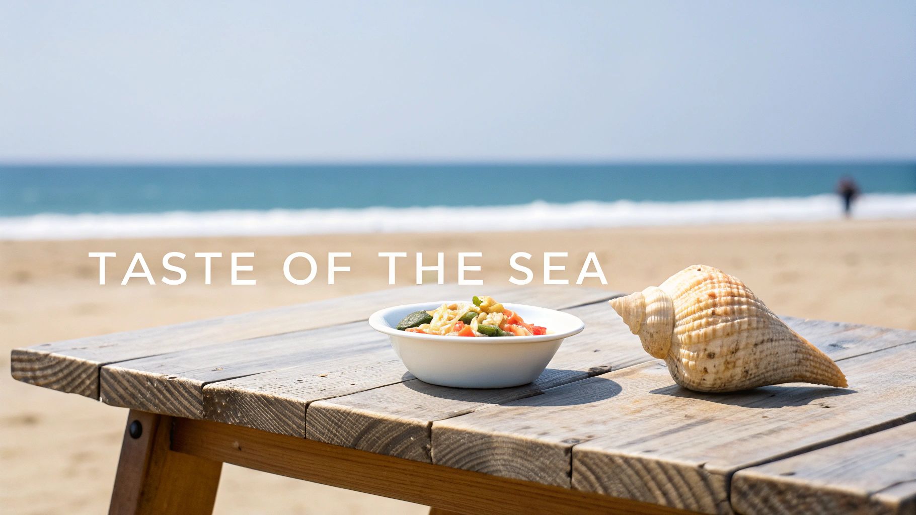 Pasta with vegetables and a conch shell on a rustic wooden table by the sea.