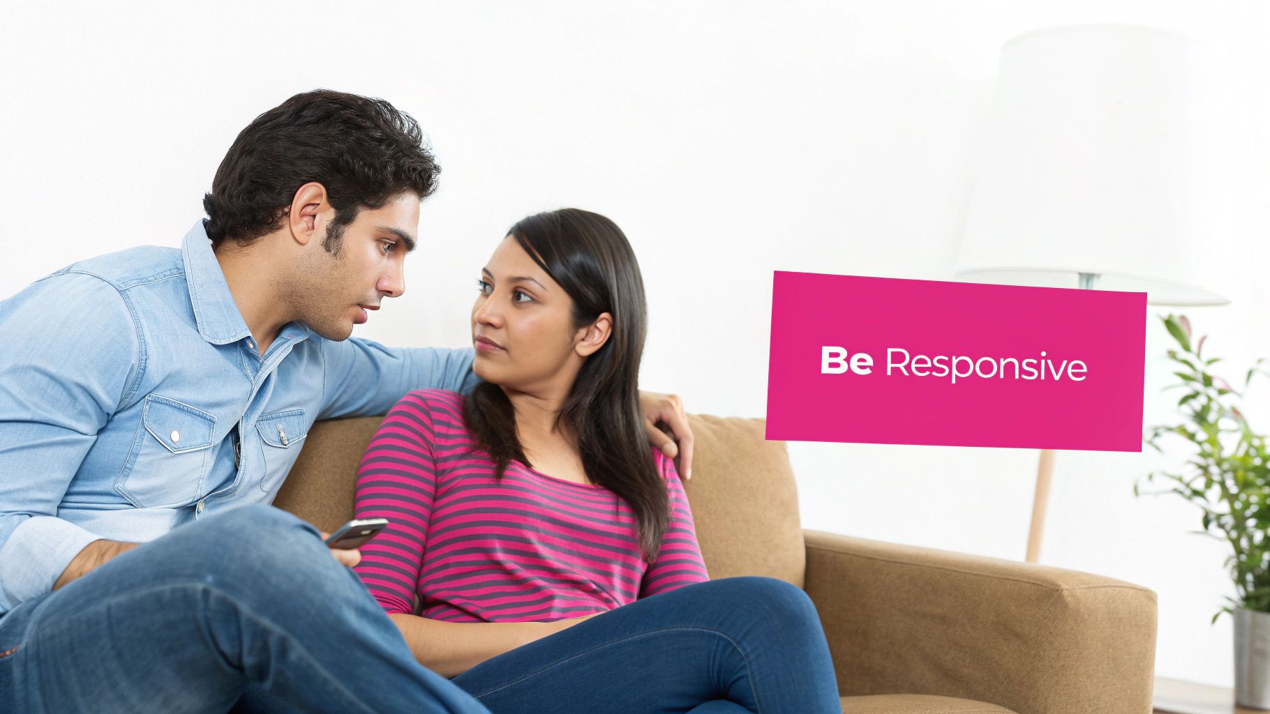 A man and woman on a couch, looking at each other, with a 'Be Responsive' sign.