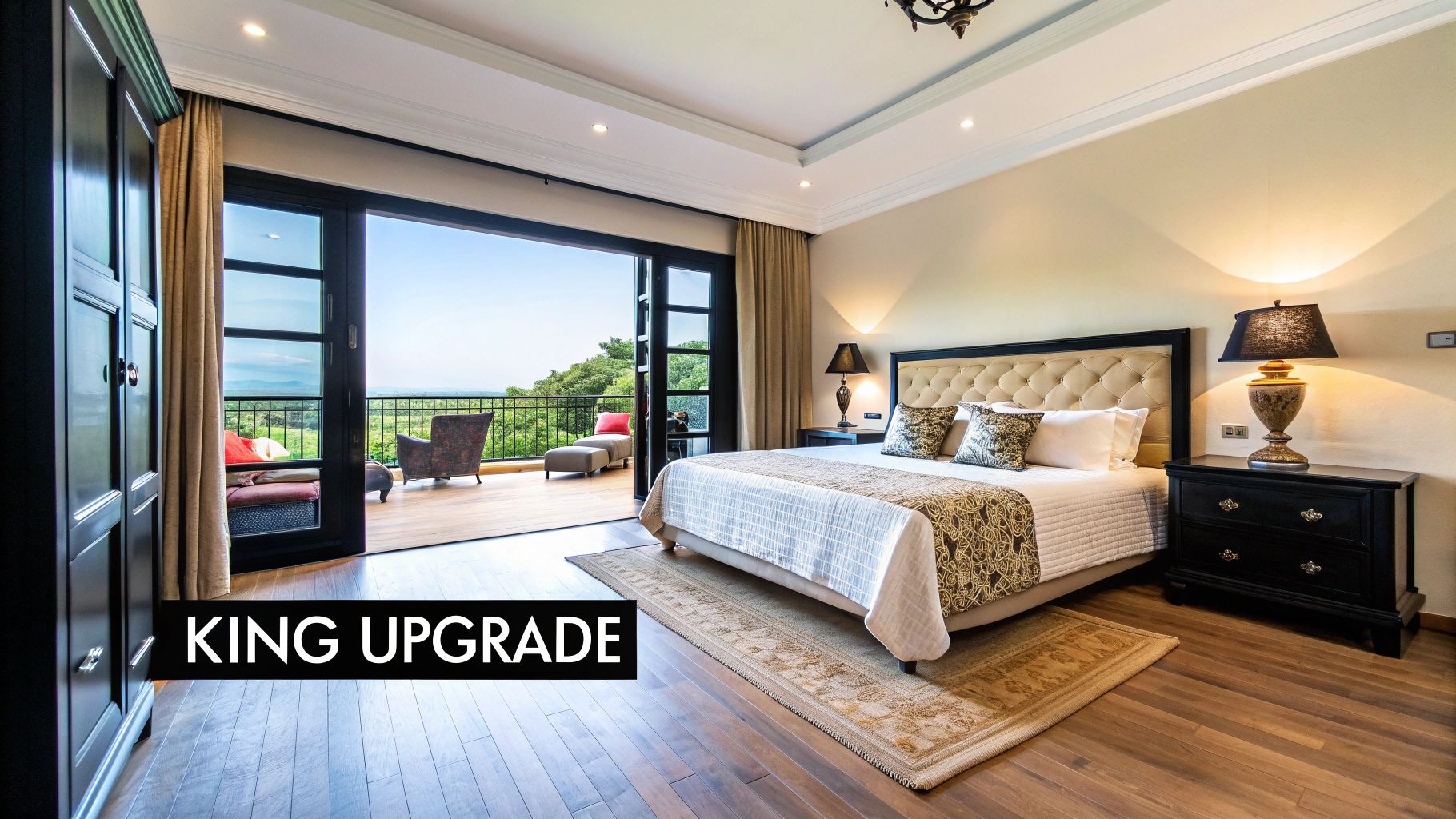 A luxurious bedroom features a large king-sized bed, dark furniture, and a balcony with a stunning mountain view.