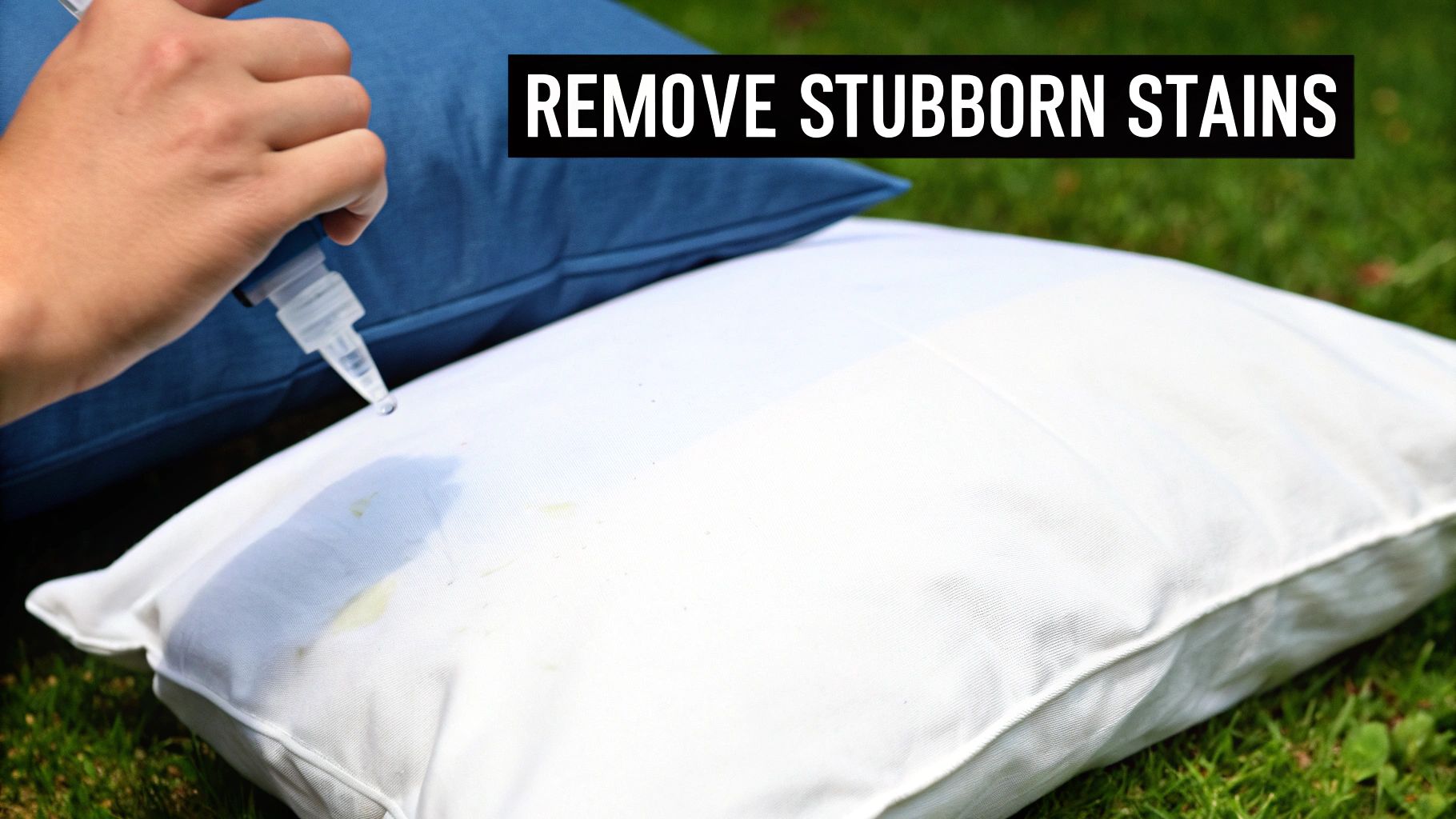 Person spraying cleaning solution on stained white pillow to remove stubborn yellow stains outdoors