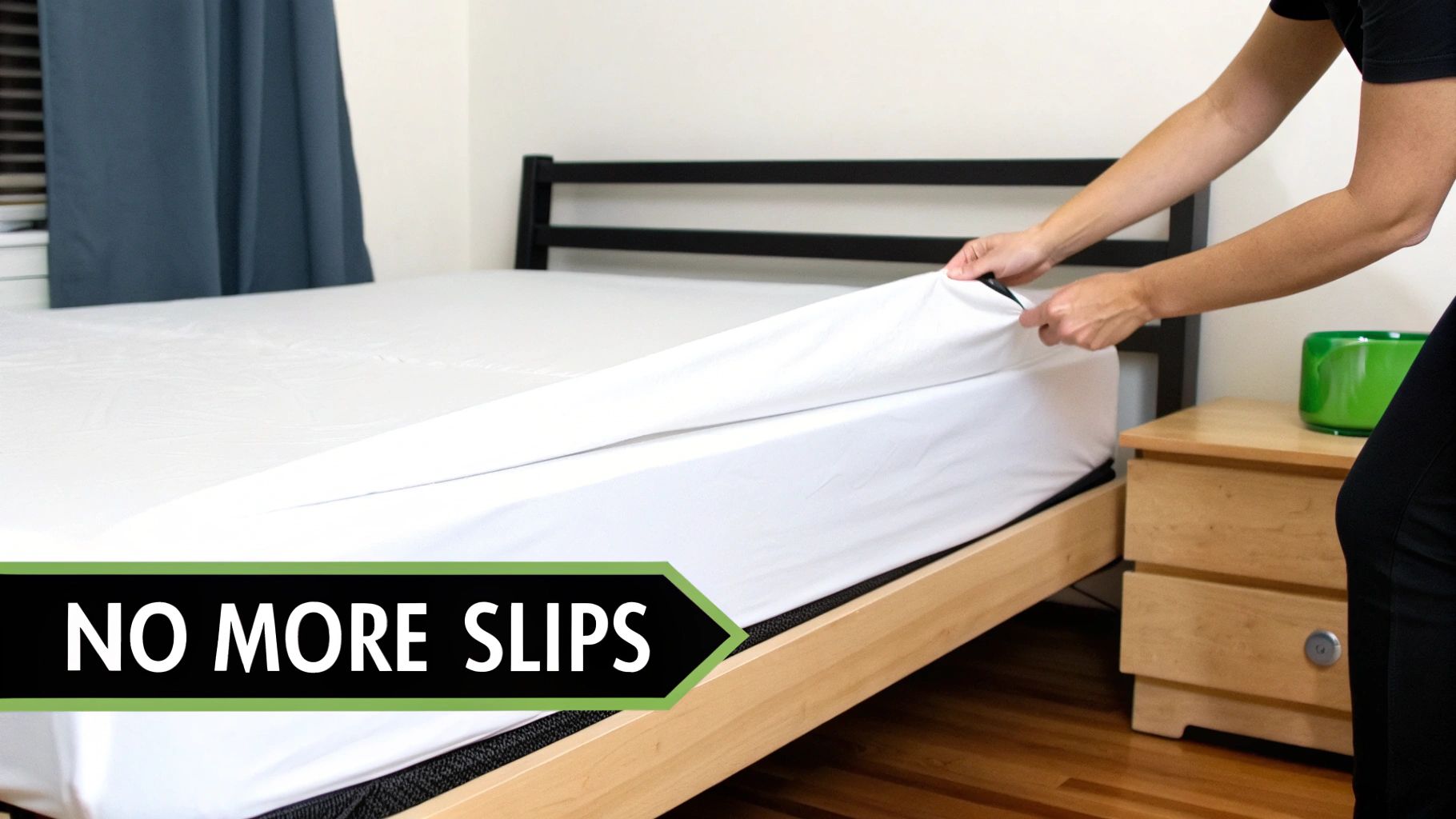 A person pulling a white fitted sheet onto a bed, showing how it fits snugly.