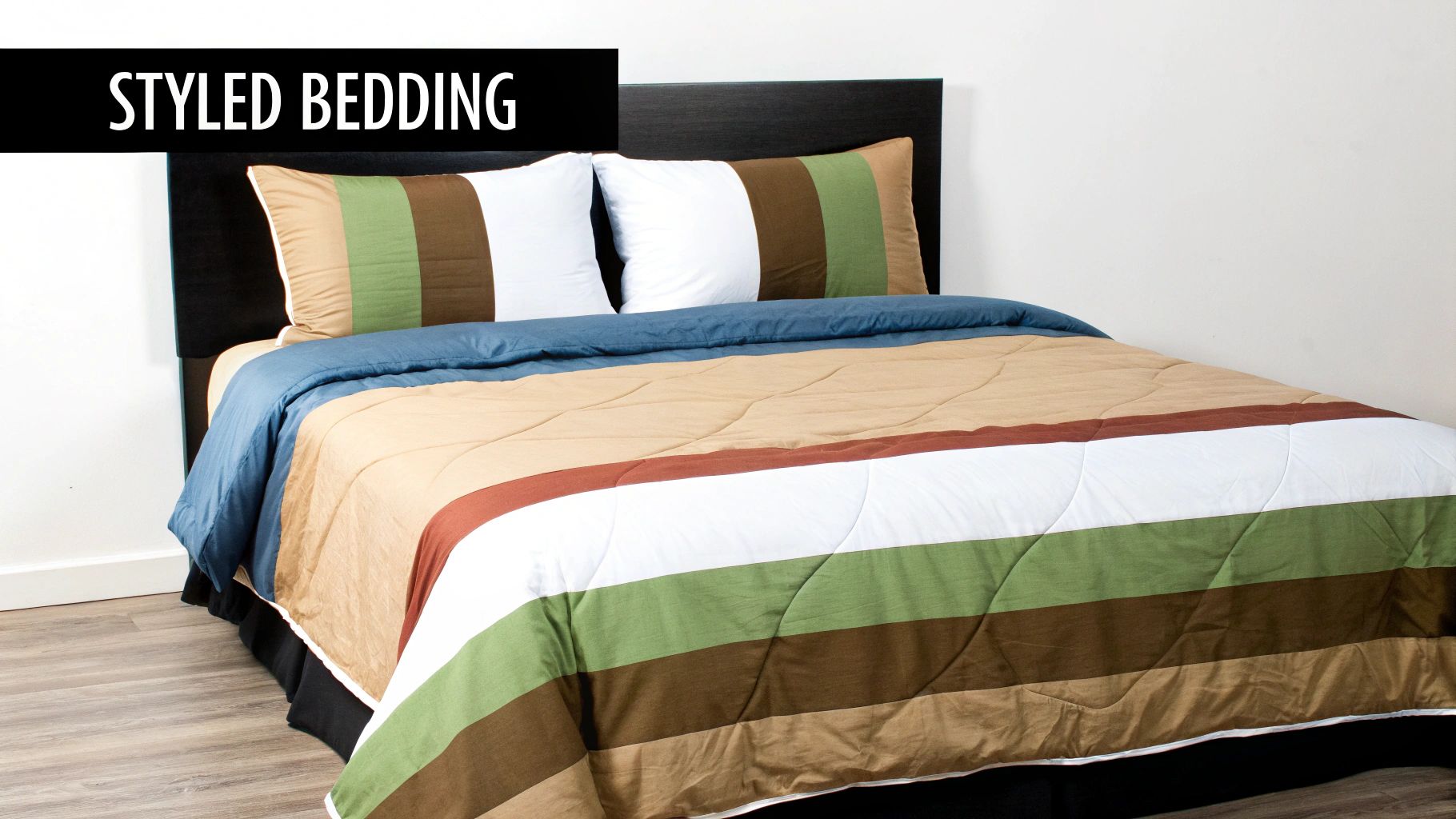 A styled bed featuring a striped comforter in earth tones, a blue duvet, and decorative pillows.