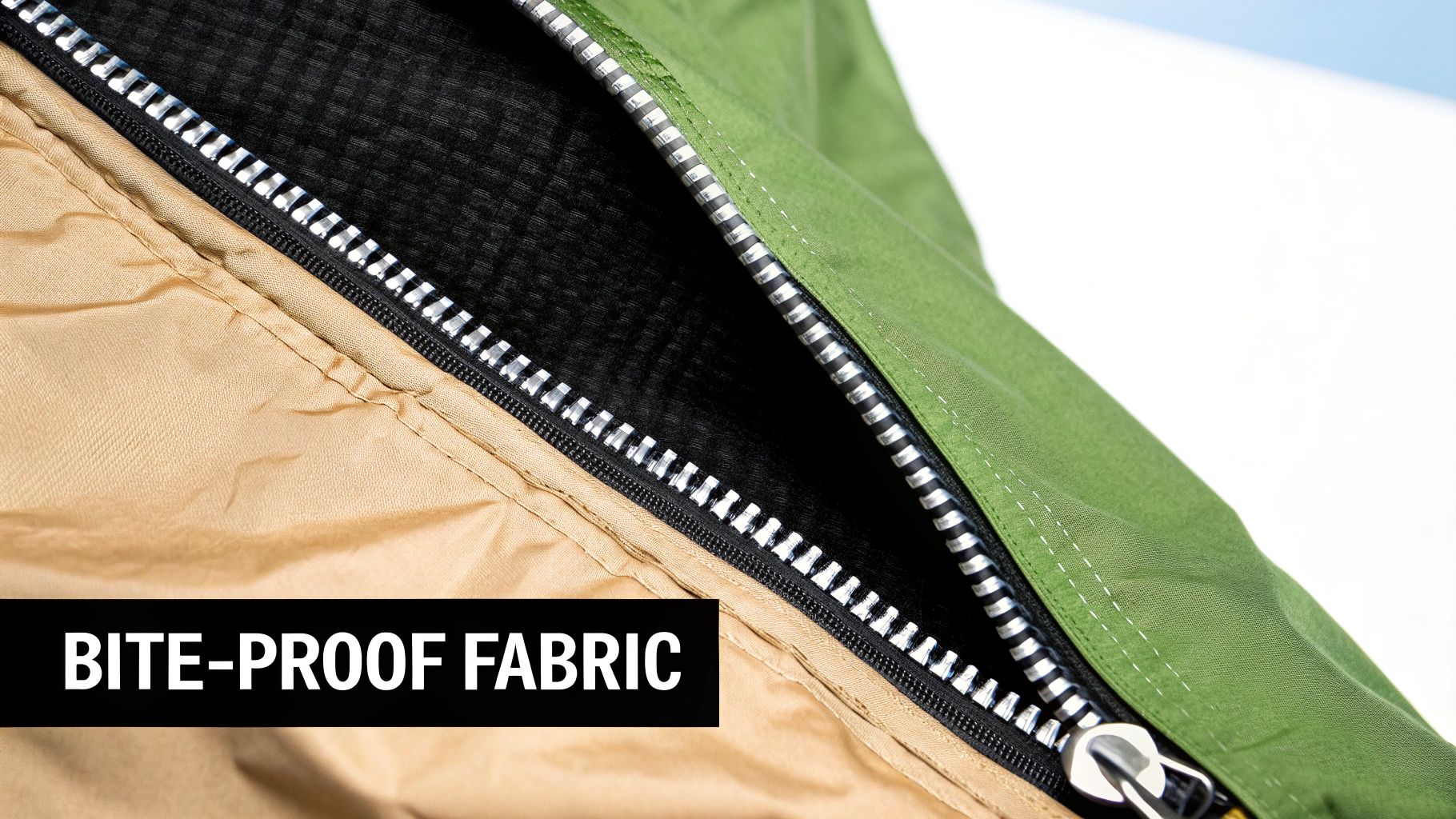 Durable bite-proof fabric with a sturdy zipper, combining tan, green, and black layers for protection.