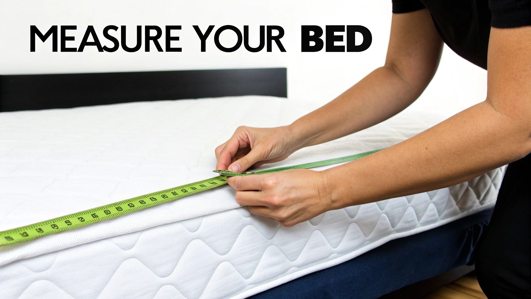 A person uses a green measuring tape to measure the side of a a white mattress, with text 'MEASURE YOUR BED'.