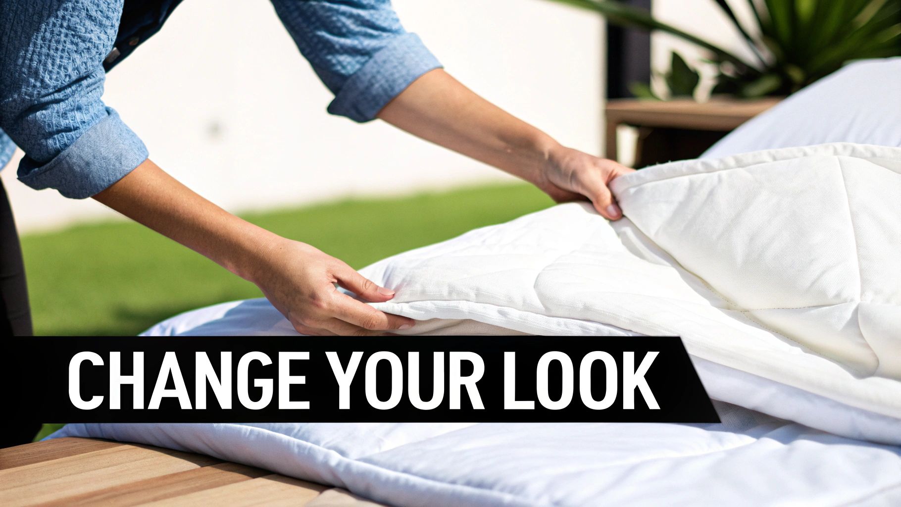 A neatly made bed with a white duvet