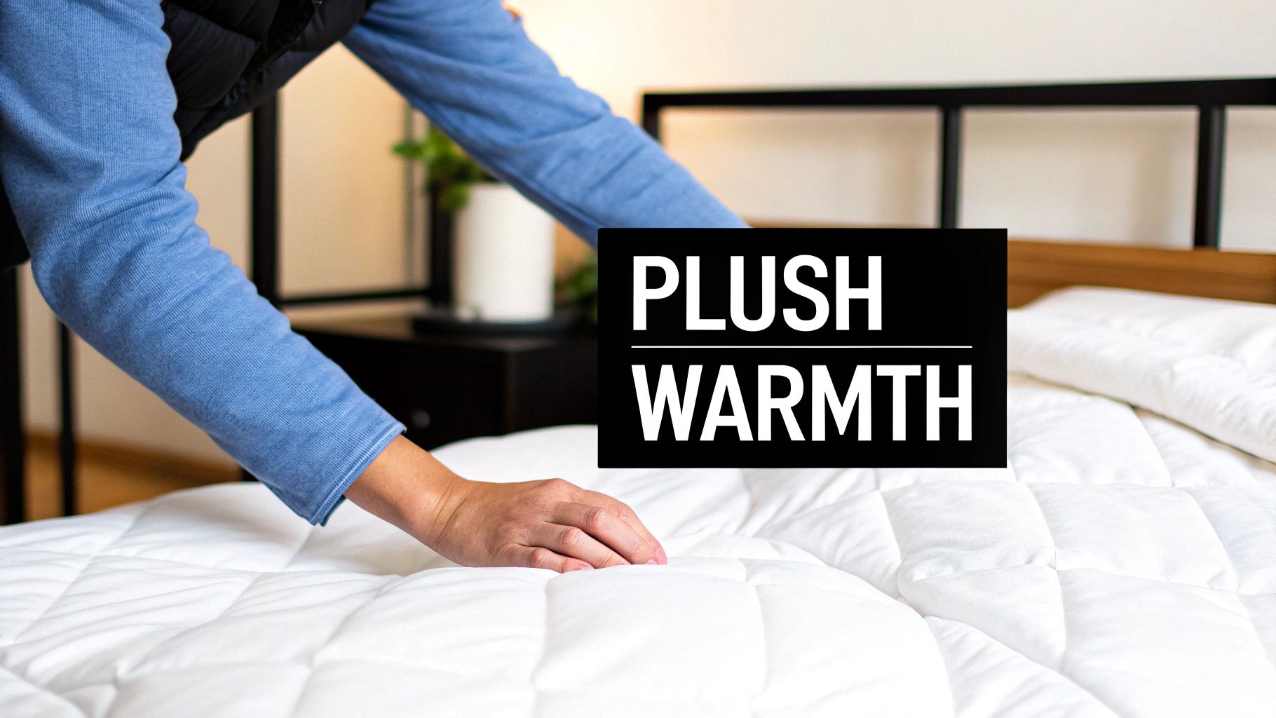 A fluffy white comforter neatly folded on a bed, showcasing its plushness and simple design.