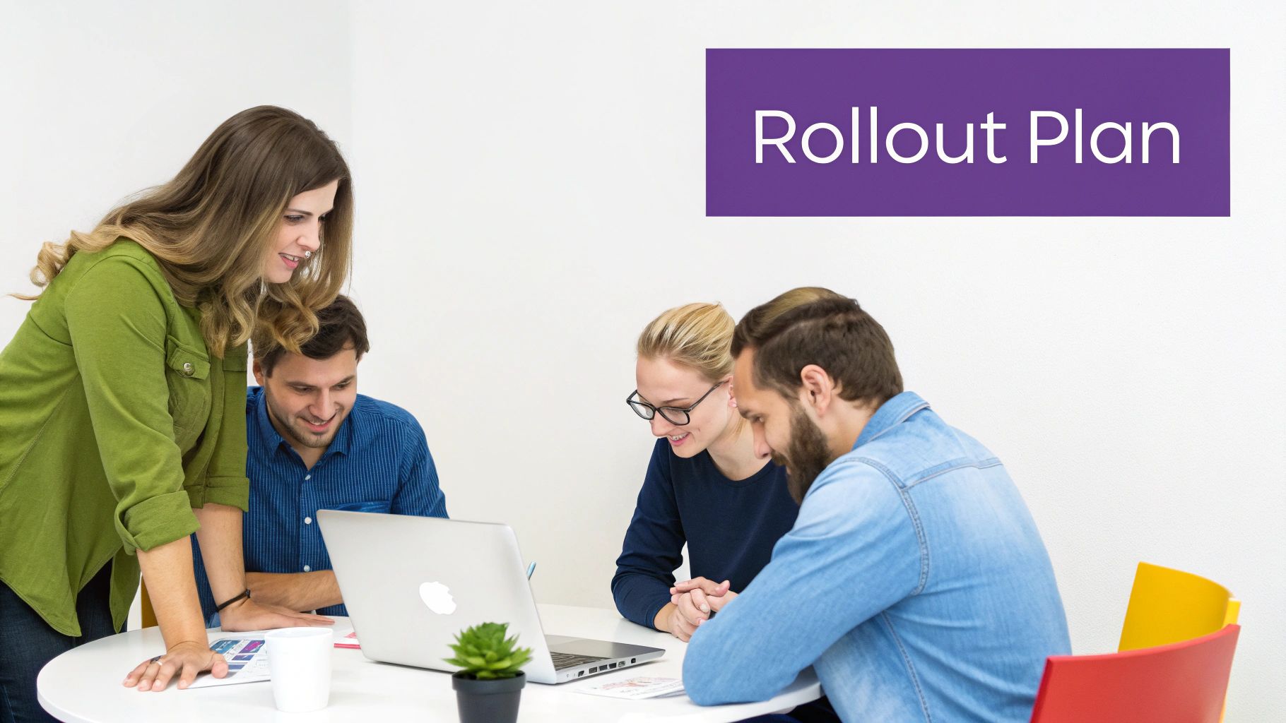 A diverse team of four professionals collaborate around a laptop, discussing a 'Rollout Plan'.