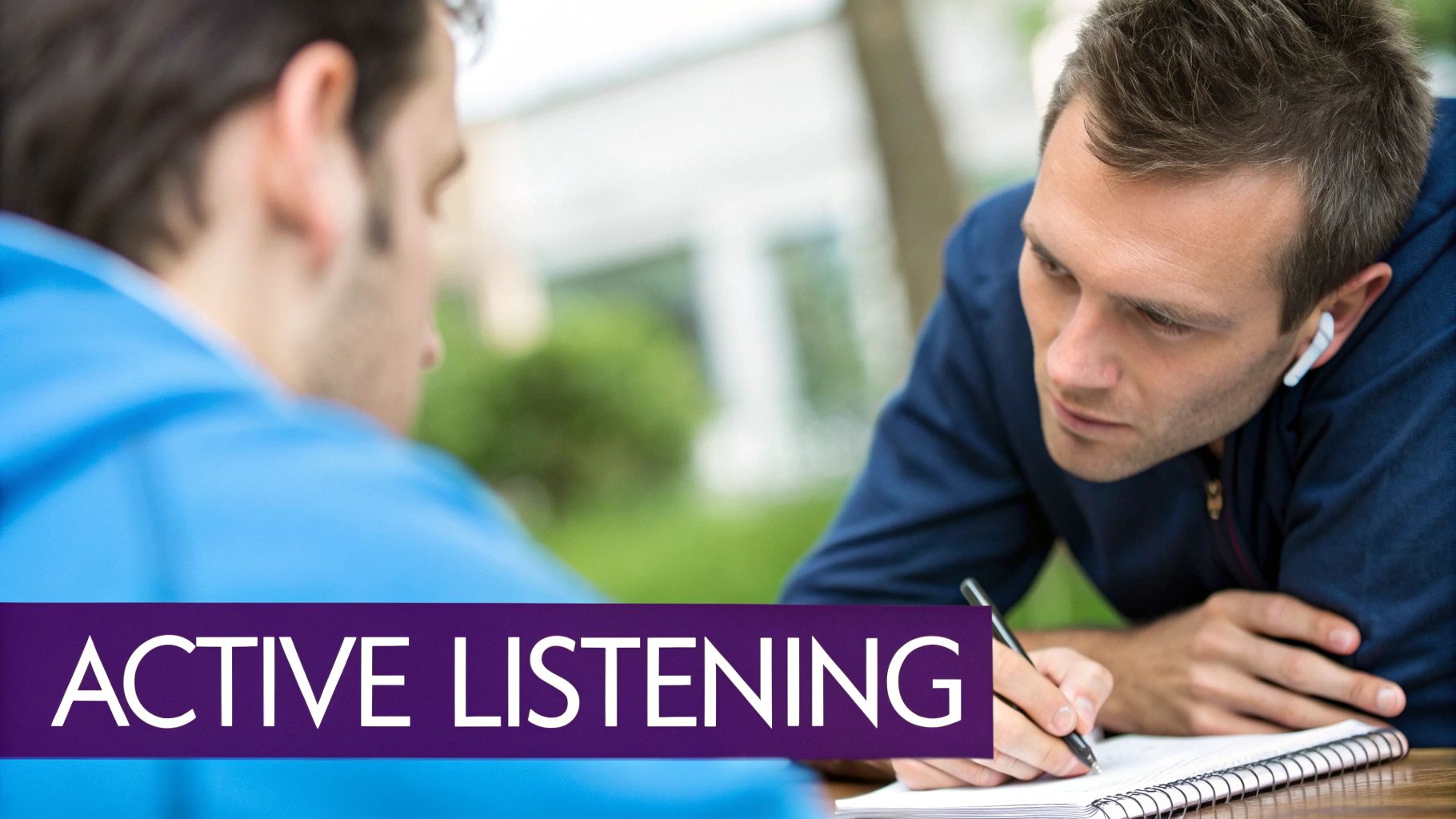 A man wearing an earbud writes notes while actively listening to another person, with 'ACTIVE LISTENING' text.