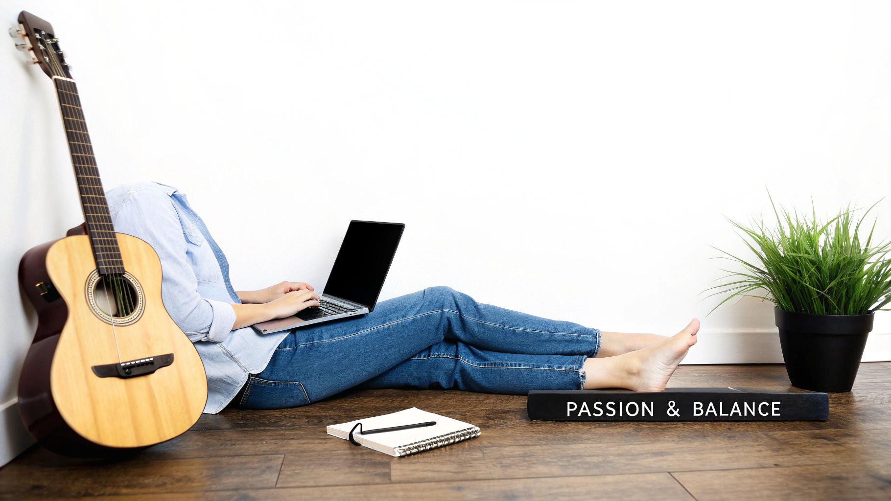 A person balances rocks on a serene beach, symbolizing the balance between a stable job and passion projects.