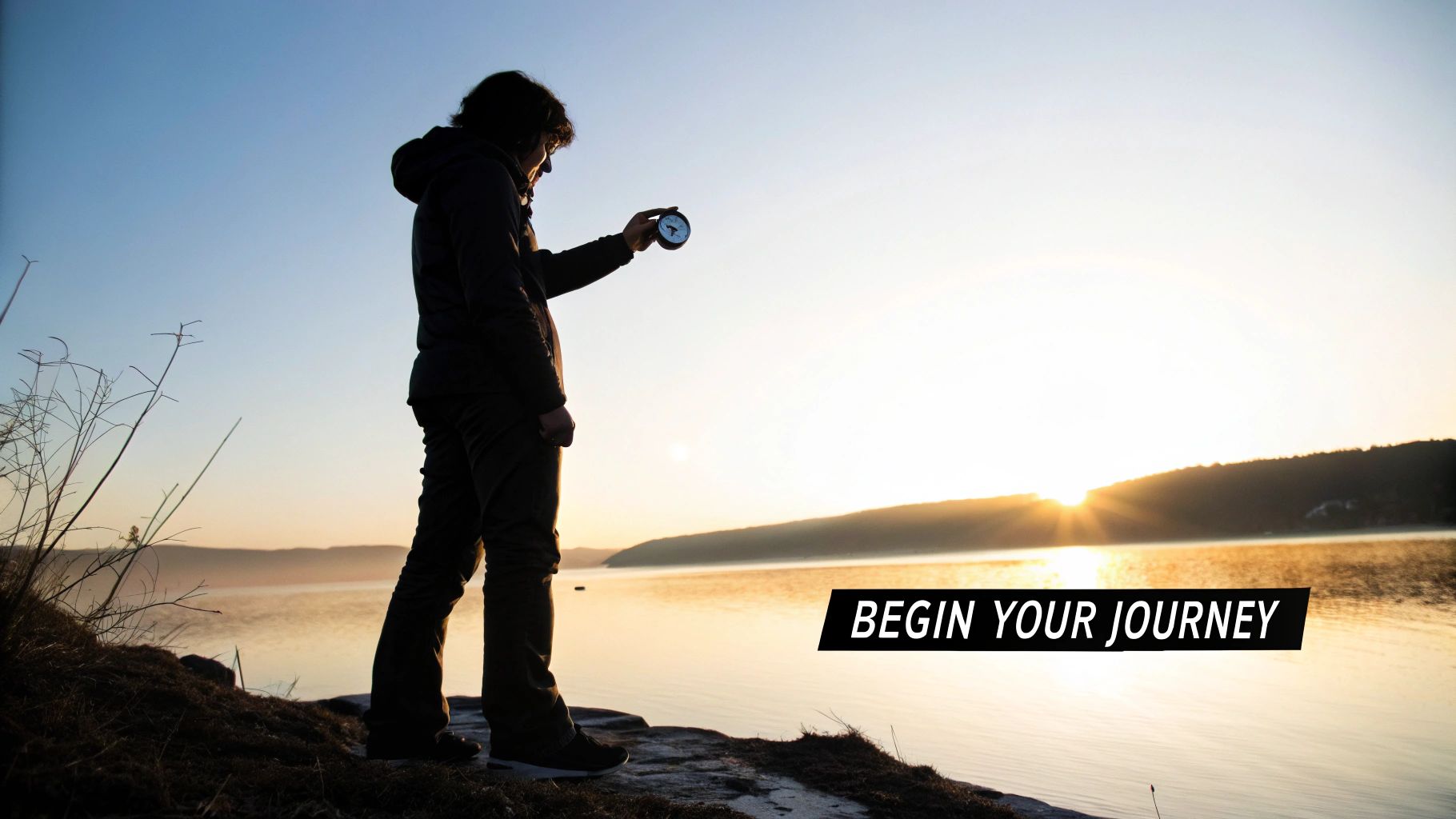A person sitting on a cliff, overlooking a beautiful landscape, reflecting on their purpose.