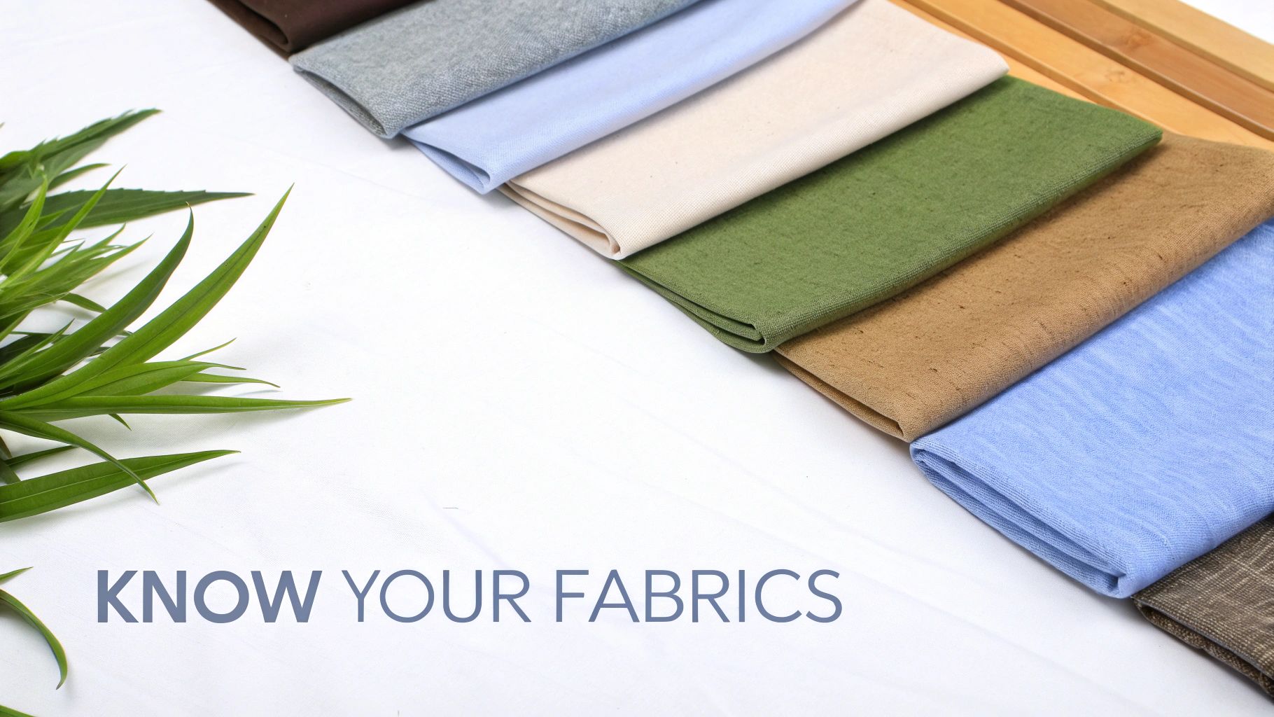 A variety of neatly folded fabric samples in different colors and textures, with green leaves and text 'KNOW YOUR FABRICS'.
