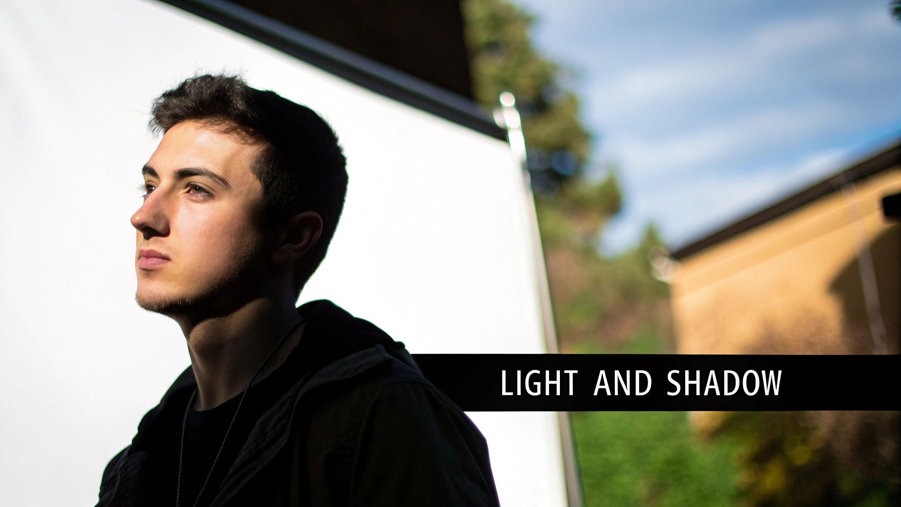 A striking portrait where a dark, shadowy background makes the brightly lit subject stand out dramatically.