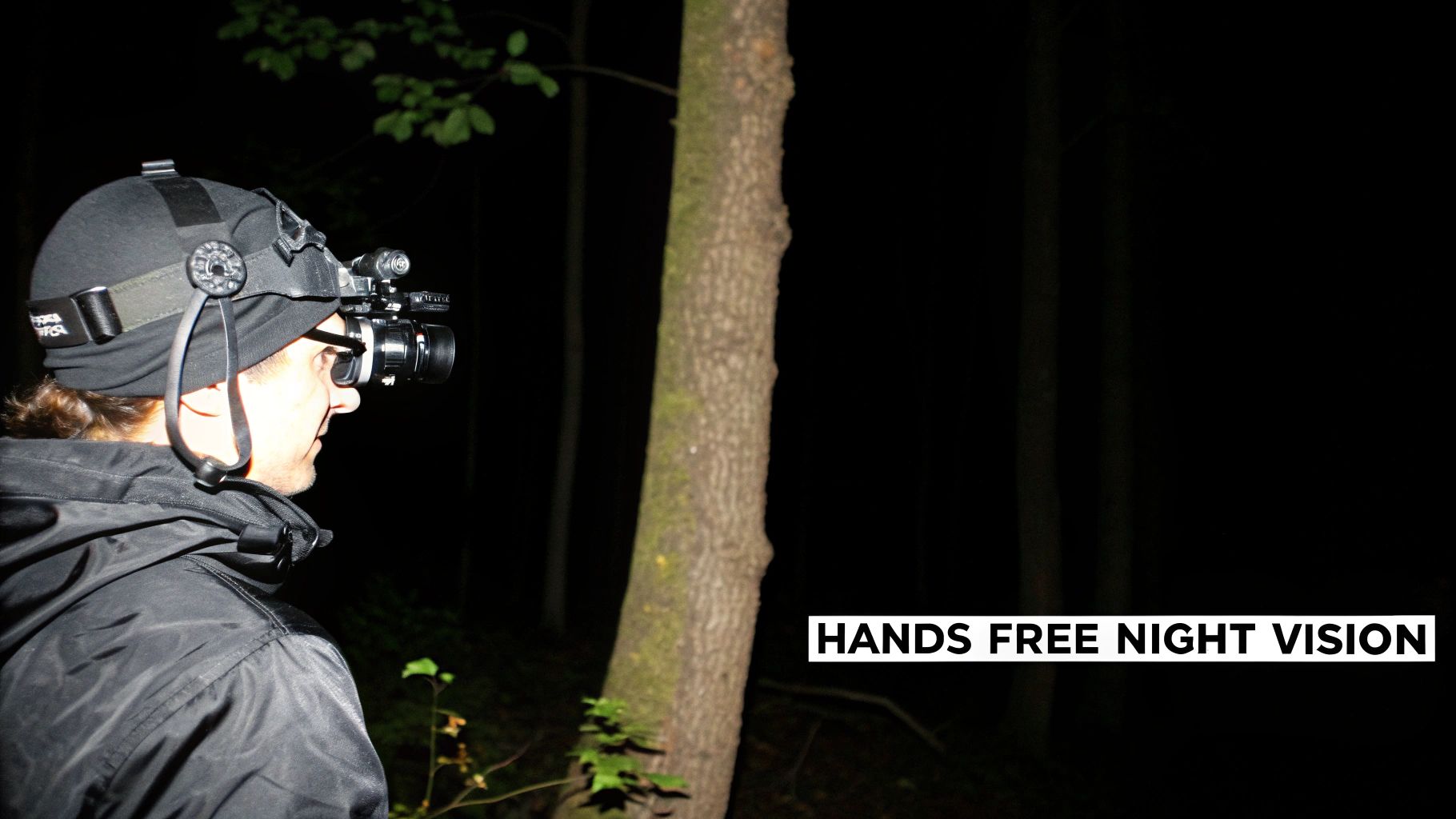 A person wearing a night vision monocular head mount system in a low-light environment