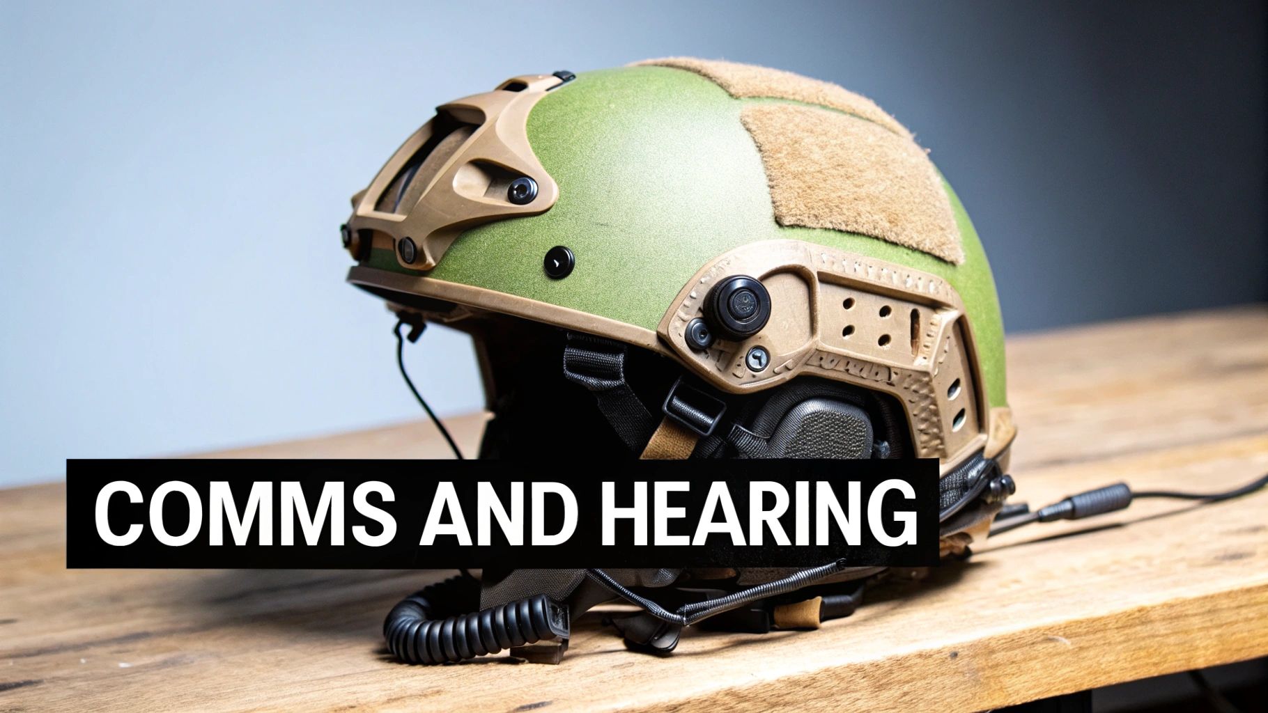 A tactical helmet equipped with a side-mounted communications headset, showcasing clean cable management.