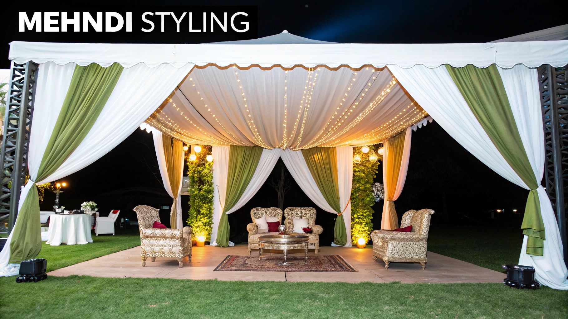 Elegant mehndi styling under a white marquee with fairy lights, green drapes, and ornate furniture.