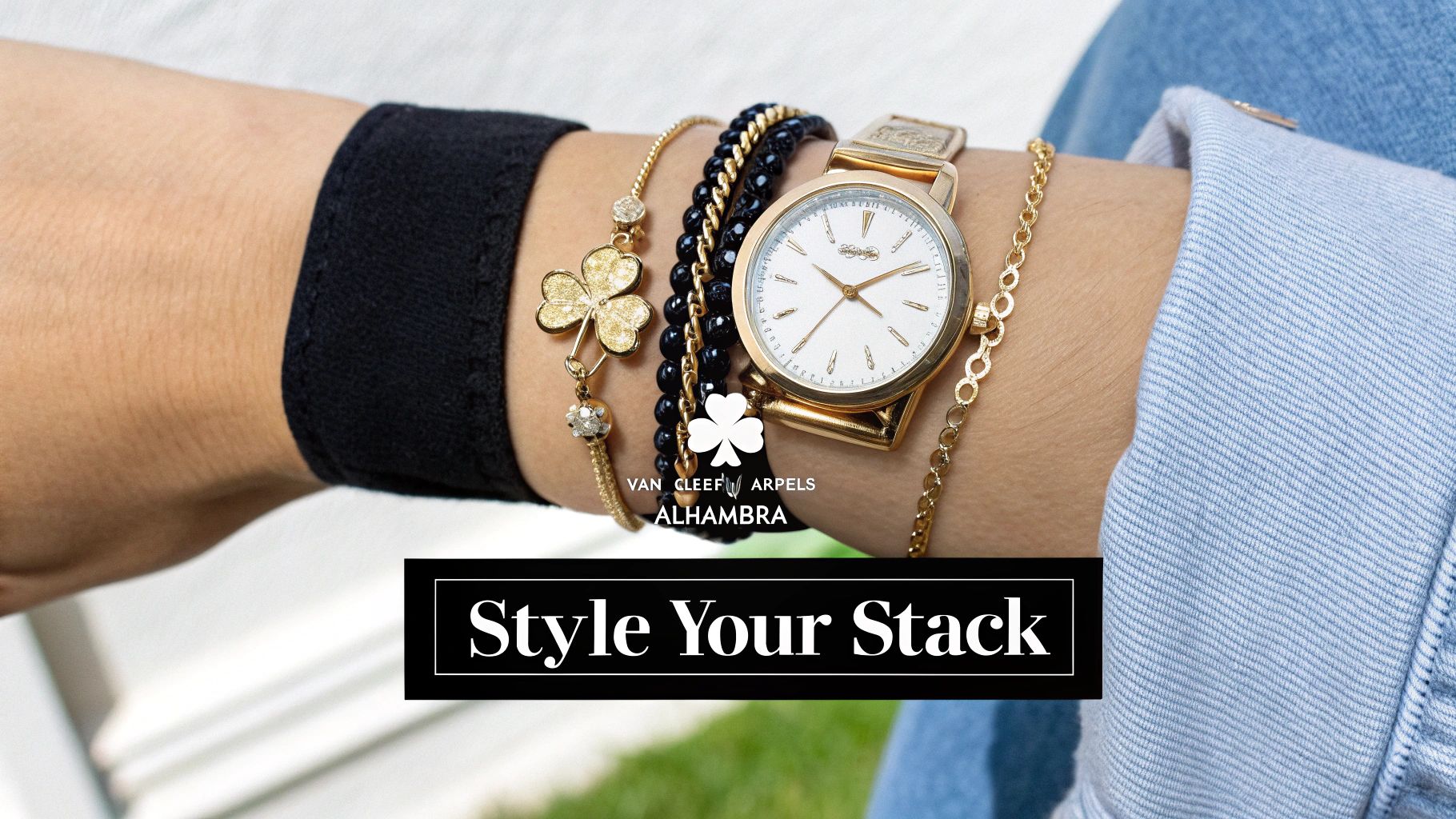 Collector stacking Van Cleef & Arpels bracelet layers