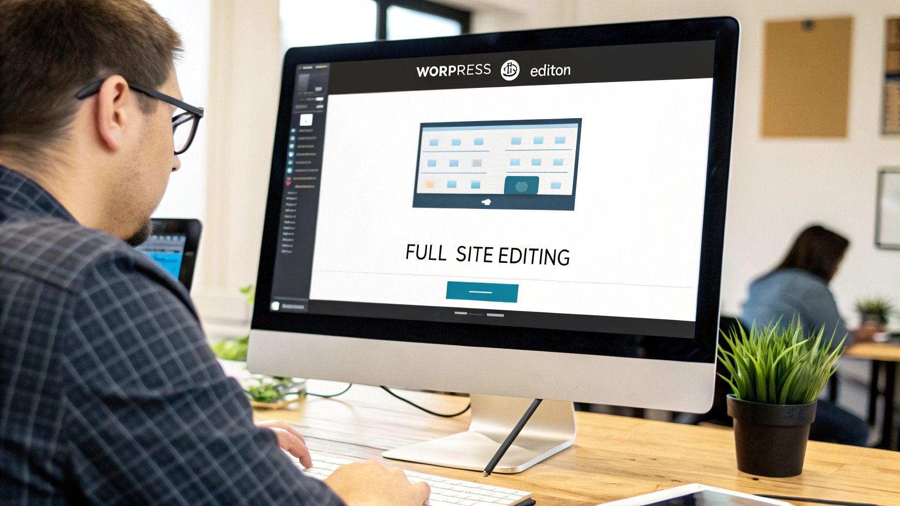 Man editing a website header on a large screen