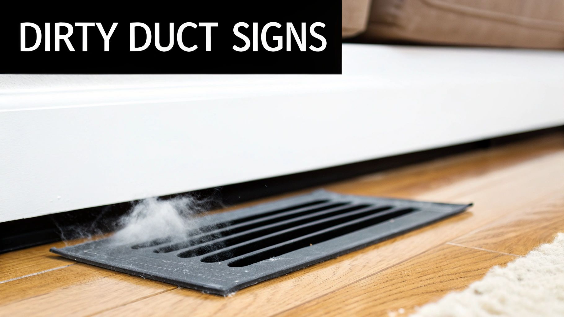 Dust and debris blowing from a dirty HVAC floor vent onto a wooden floor, signaling a need for cleaning.