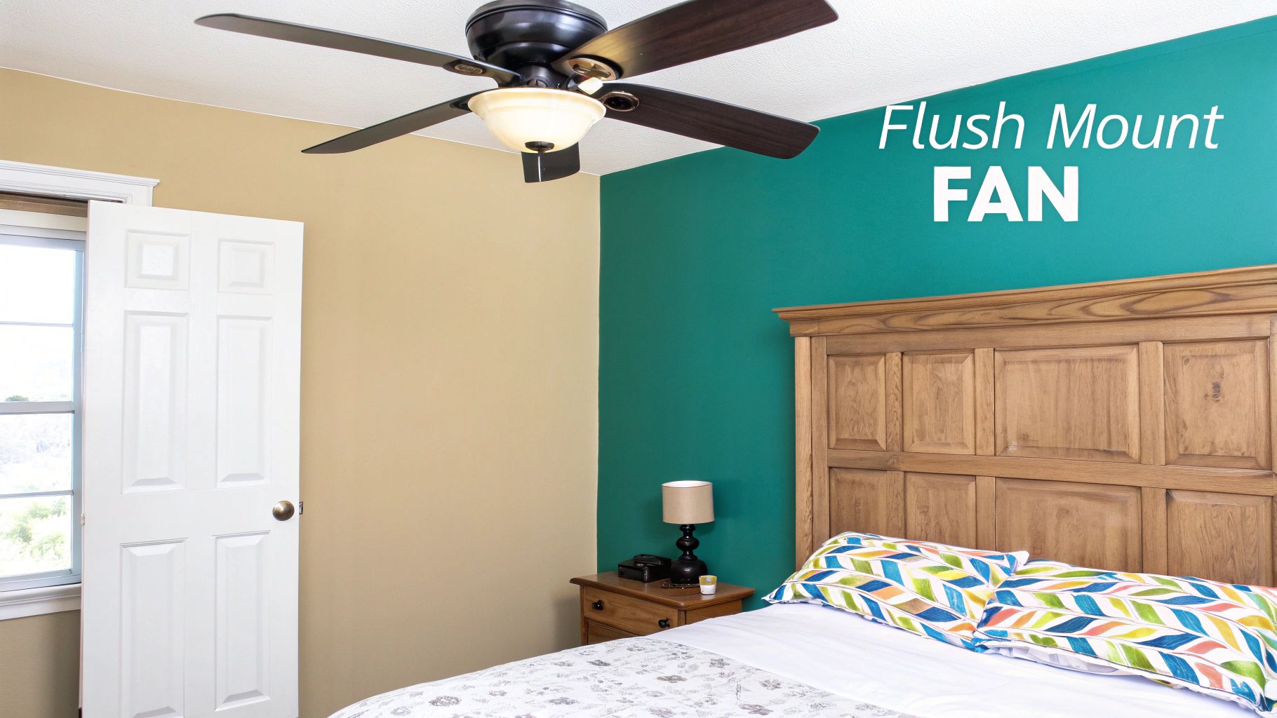 A stylish flush mount ceiling fan with a light, installed in a modern bedroom with a low ceiling.