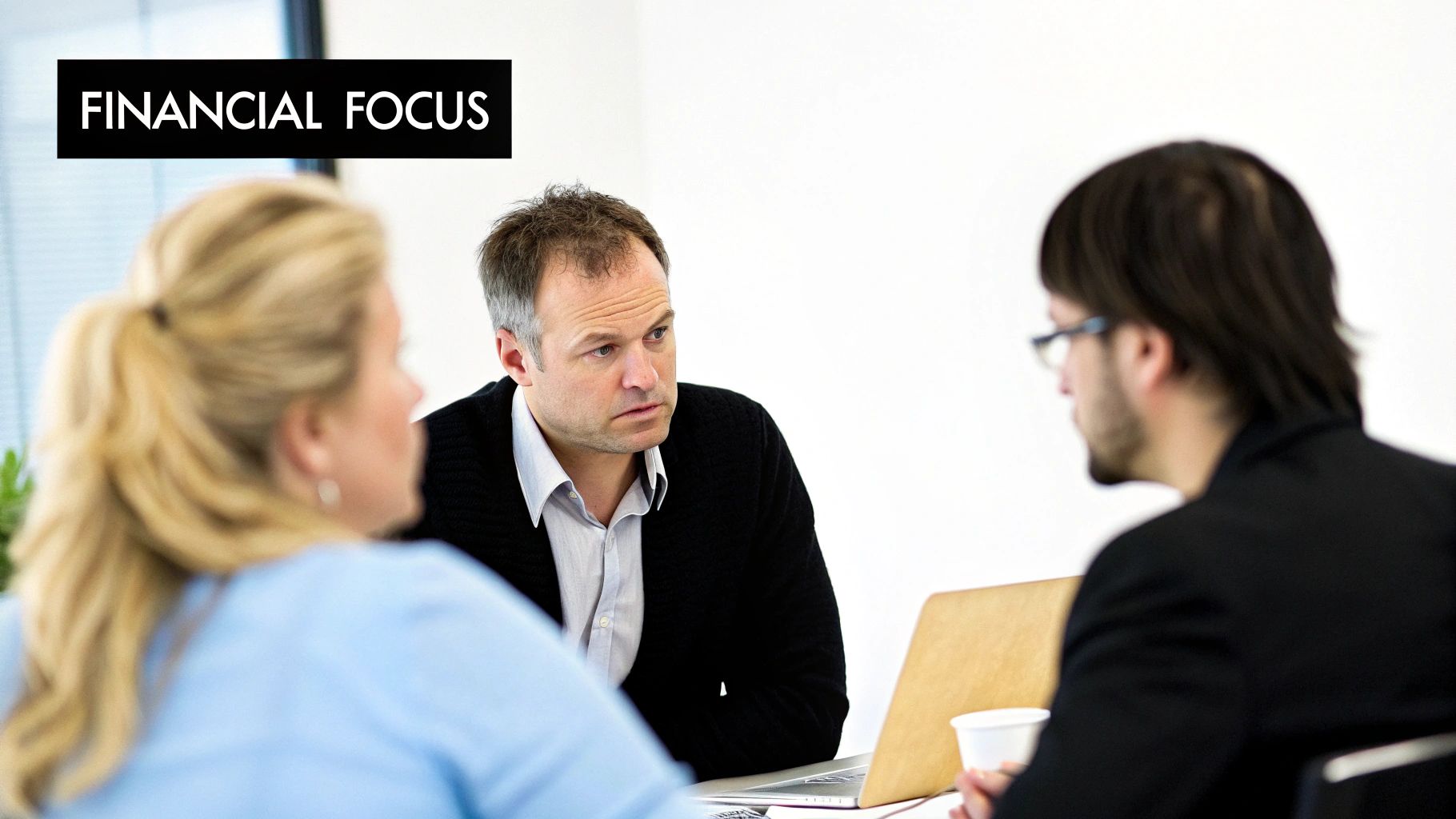 Employees looking relieved and confident while reviewing financial documents together.