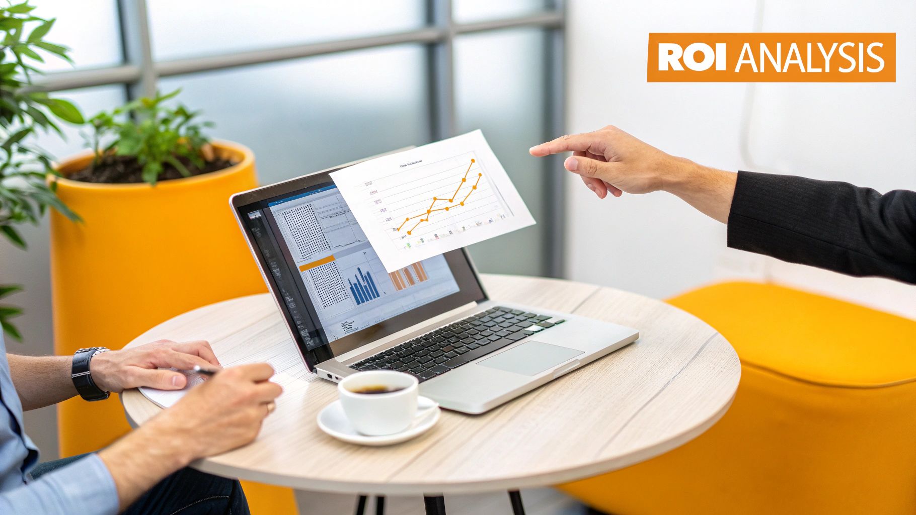 Two business people analyze ROI data with charts on a laptop and a printed graph.