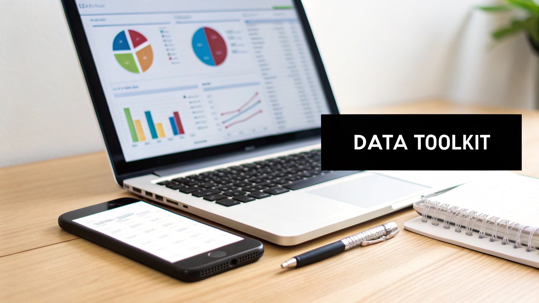 A laptop displaying data analysis charts, a smartphone, pen, and notebook on a desk, with 'DATA TOOLKIT' overlay.