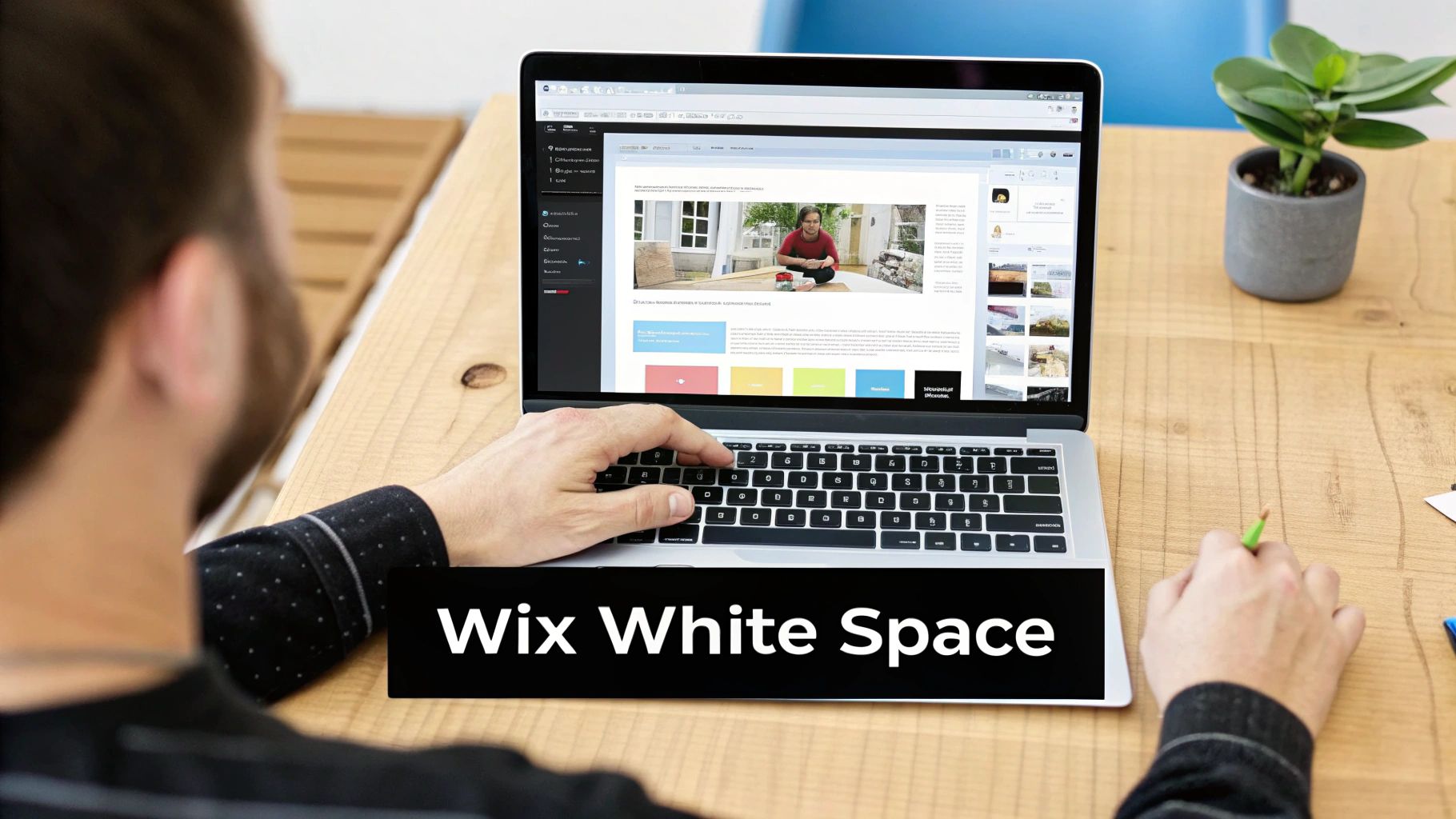 Person working on a laptop, designing a website on Wix with various elements and white space.
