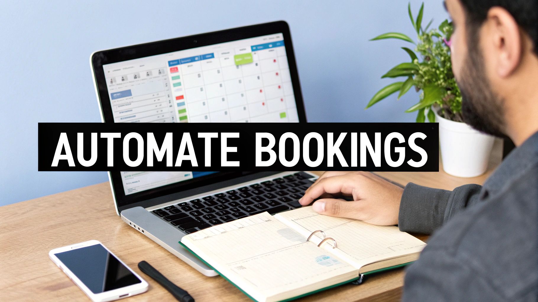 A person uses a laptop displaying an online booking calendar, with a notebook and smartphone on the desk.