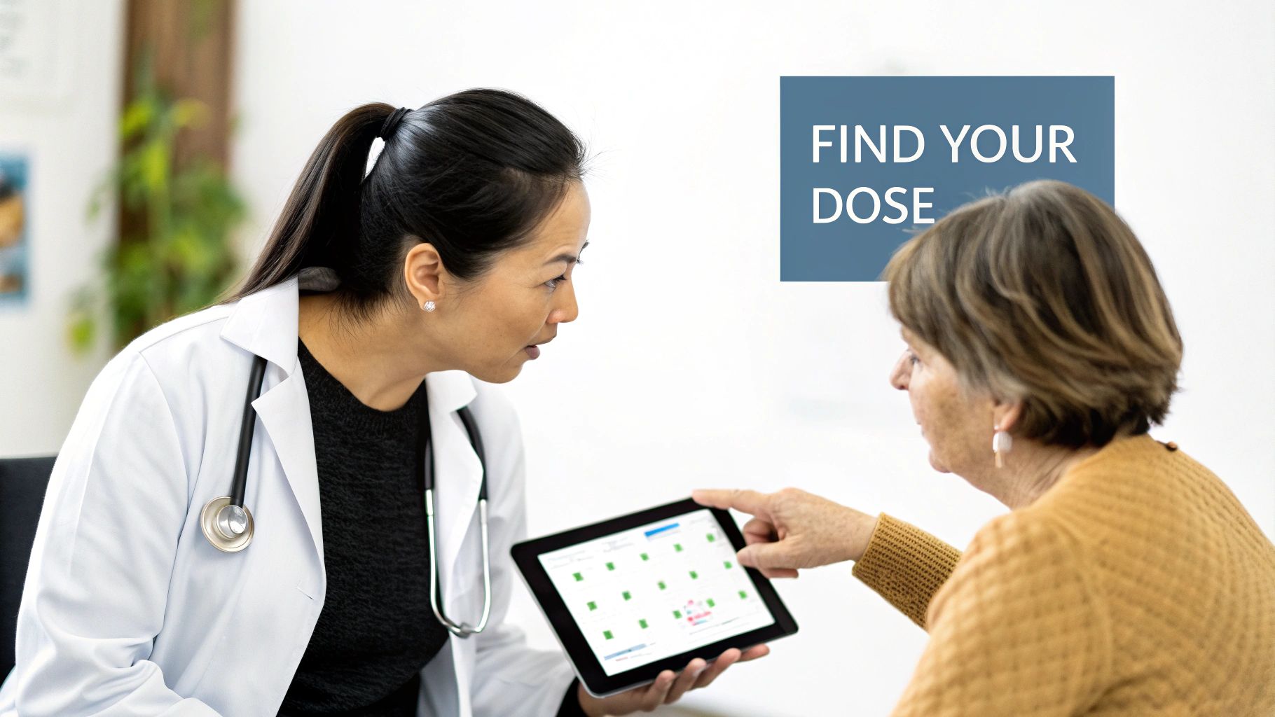 A female doctor shows a tablet with dosage information to an elderly female patient.