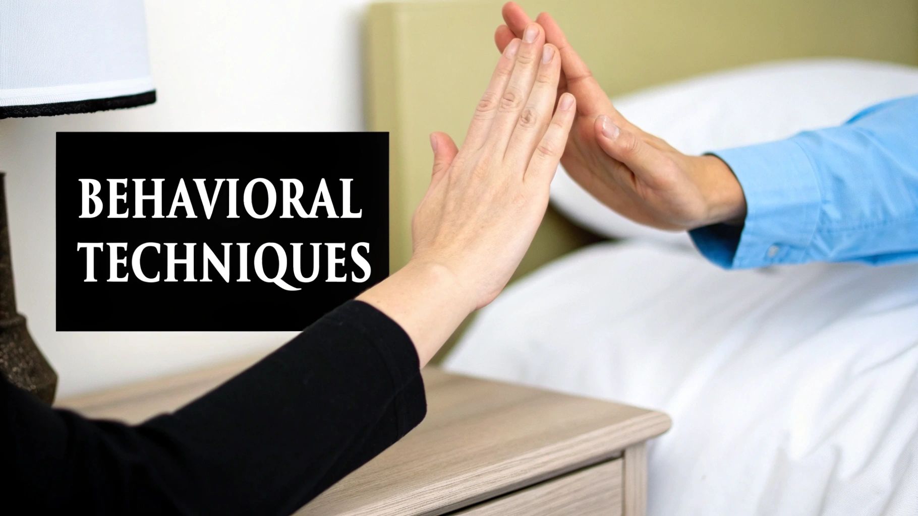 Two hands reaching towards each other, one in a black sleeve, the other blue, with "BEHAVIORAL TECHNIQUES" text.