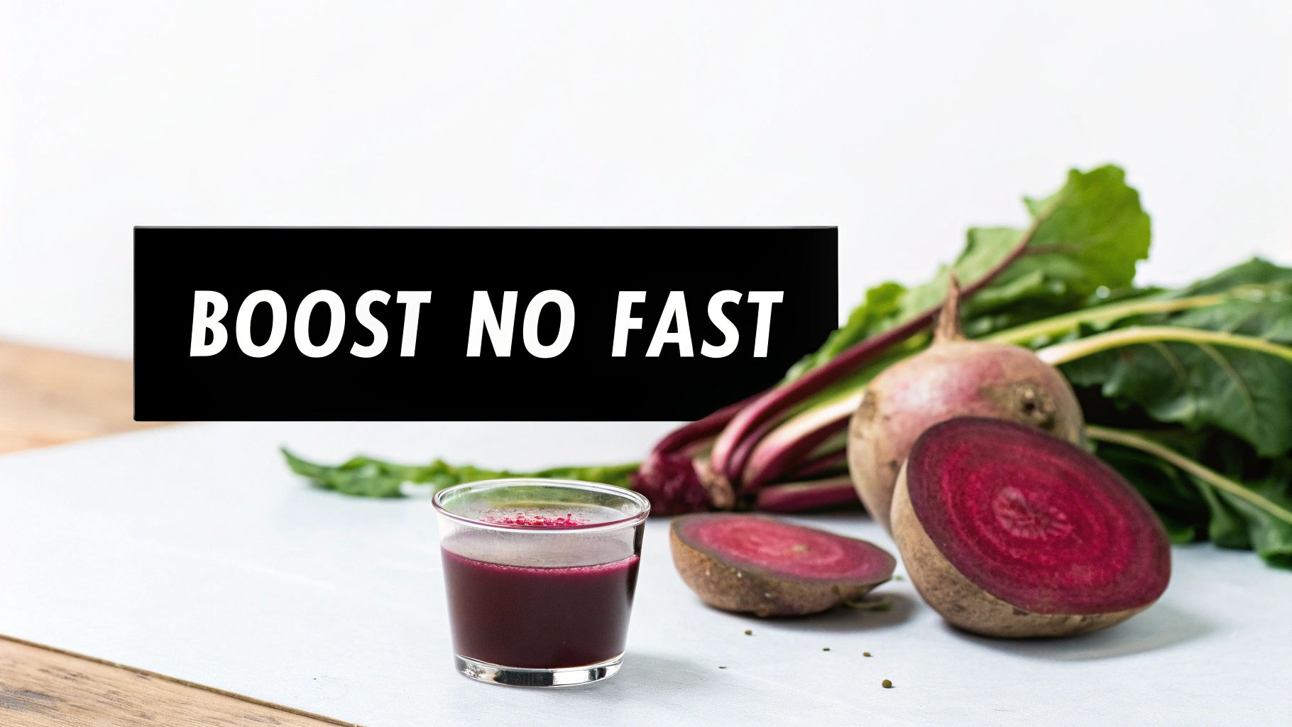 A glass of red beetroot juice and fresh sliced and whole beetroots with green tops. A banner says 'BOOST NO FAST'.