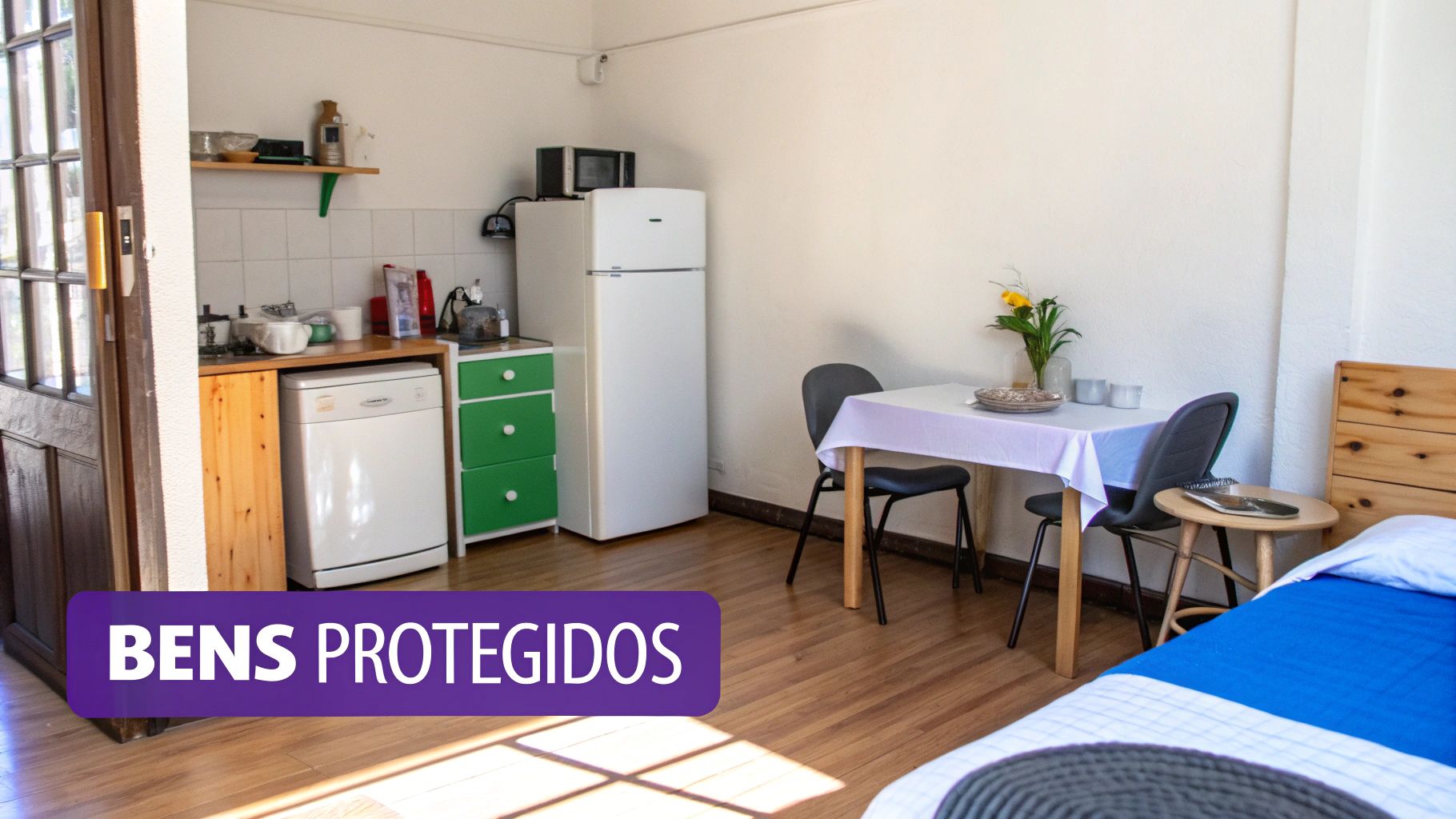 Um estúdio acolhedor com kitchenette, mesa de jantar e área de dormir, ideal para espaços pequenos.